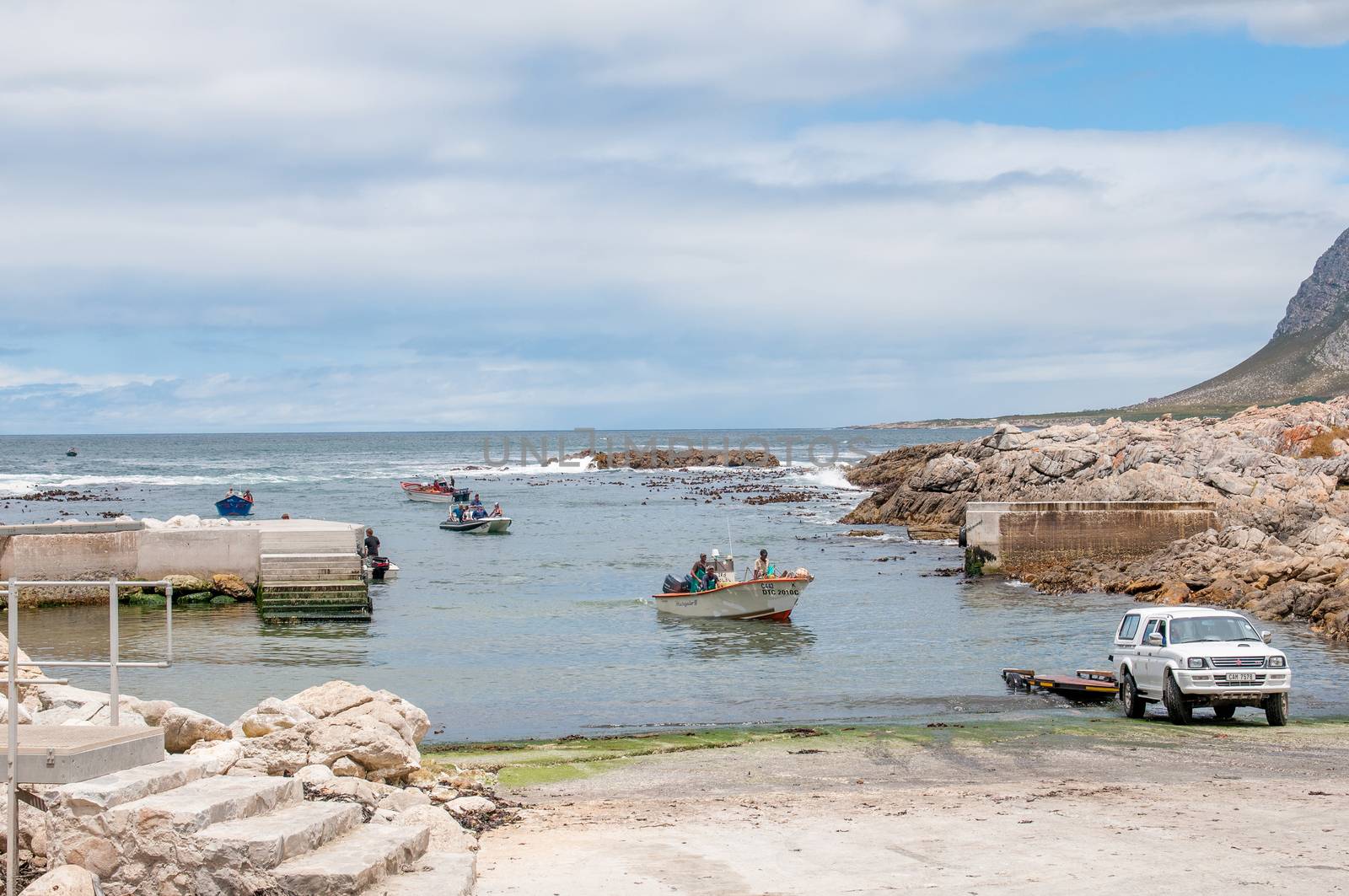 KLEINMOND, SOUTH AFRICA - DECEMBER 23, 2014: Crayfish boats arriving at the harbor to be pulled out of the water
