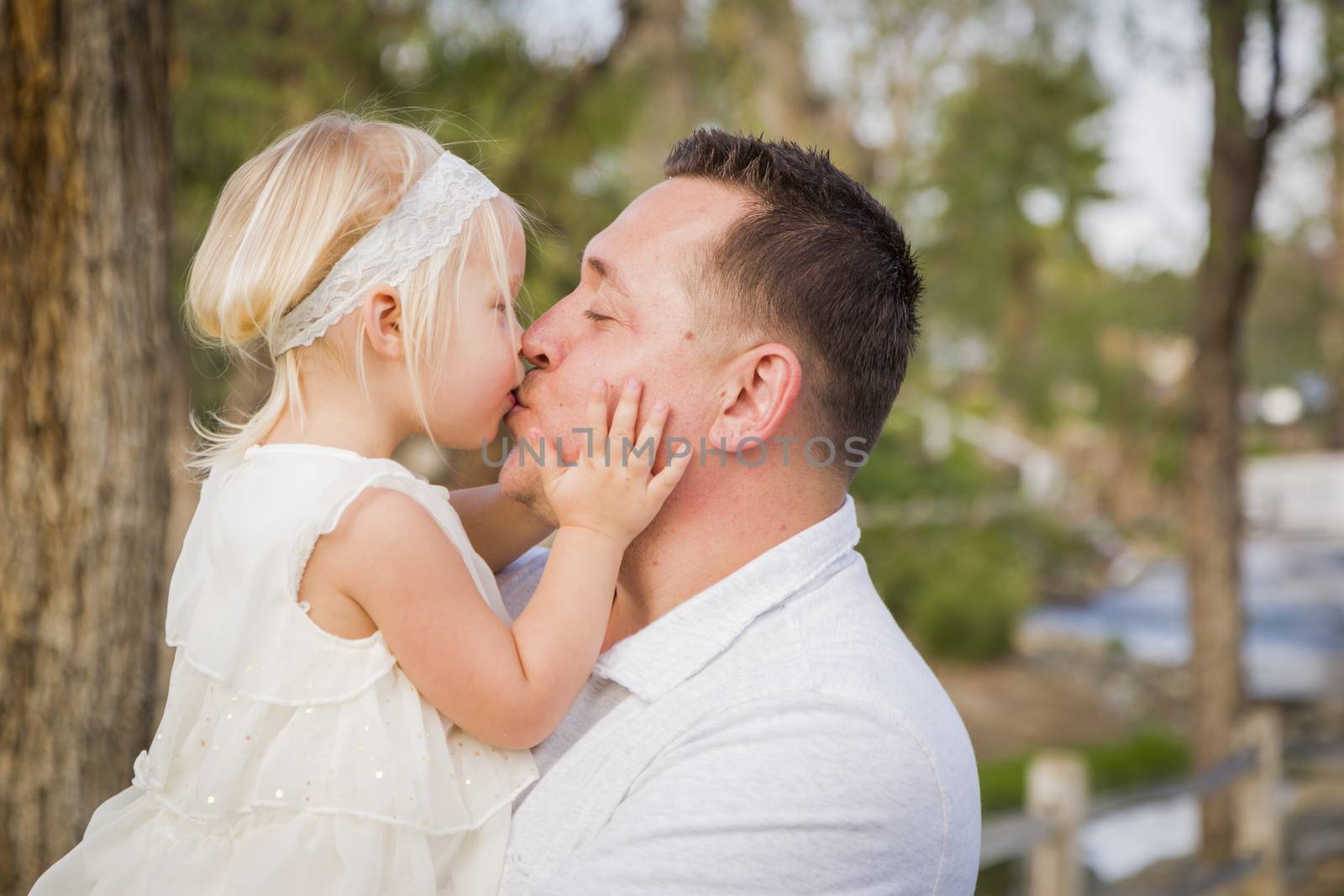 Father Playing With Cute Baby Girl Outside at the Park by Feverpitched