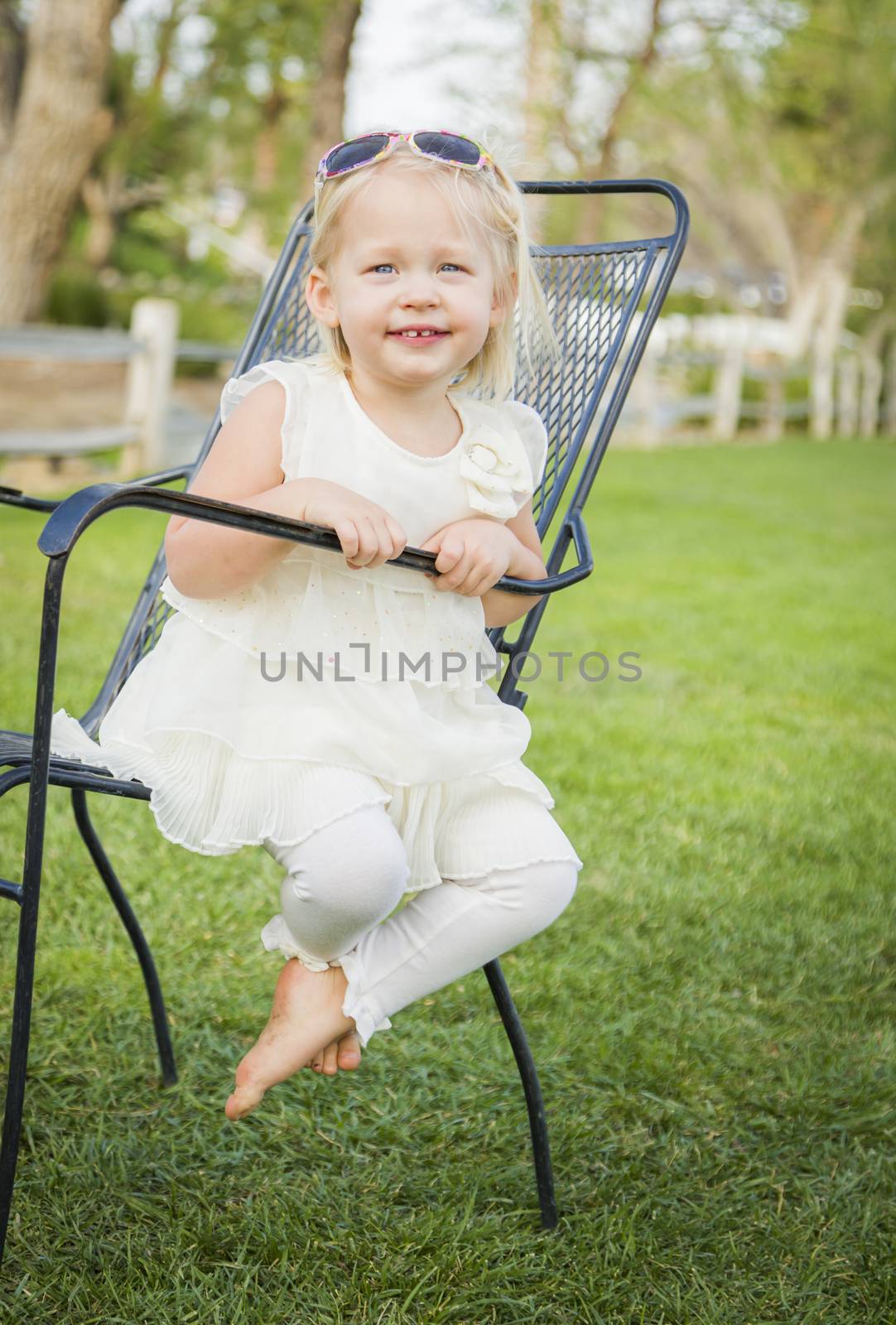 Cute Playful Baby Girl Portrait Outside at the Park.
