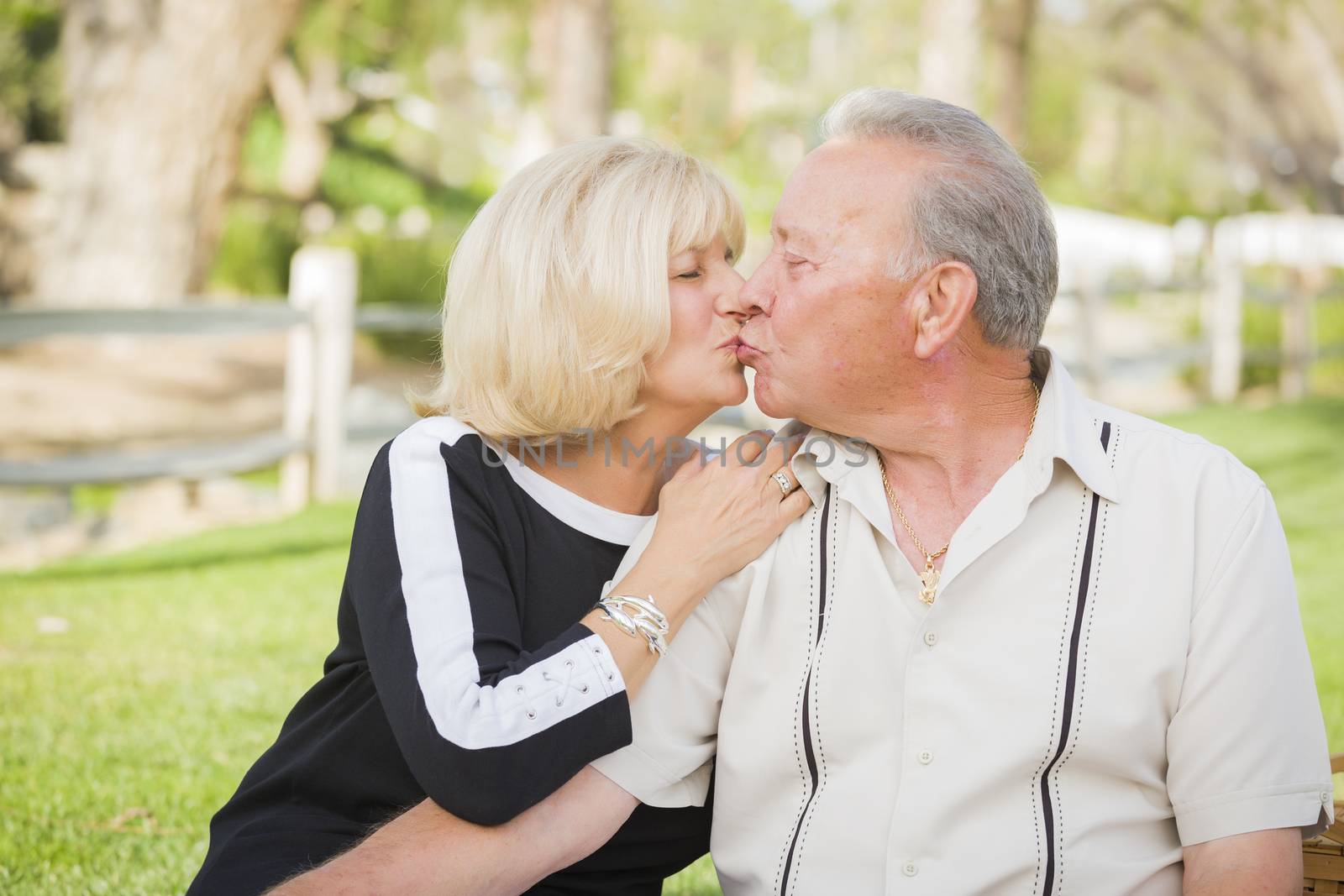 Affectionate Senior Couple Portrait Outside At The Park.