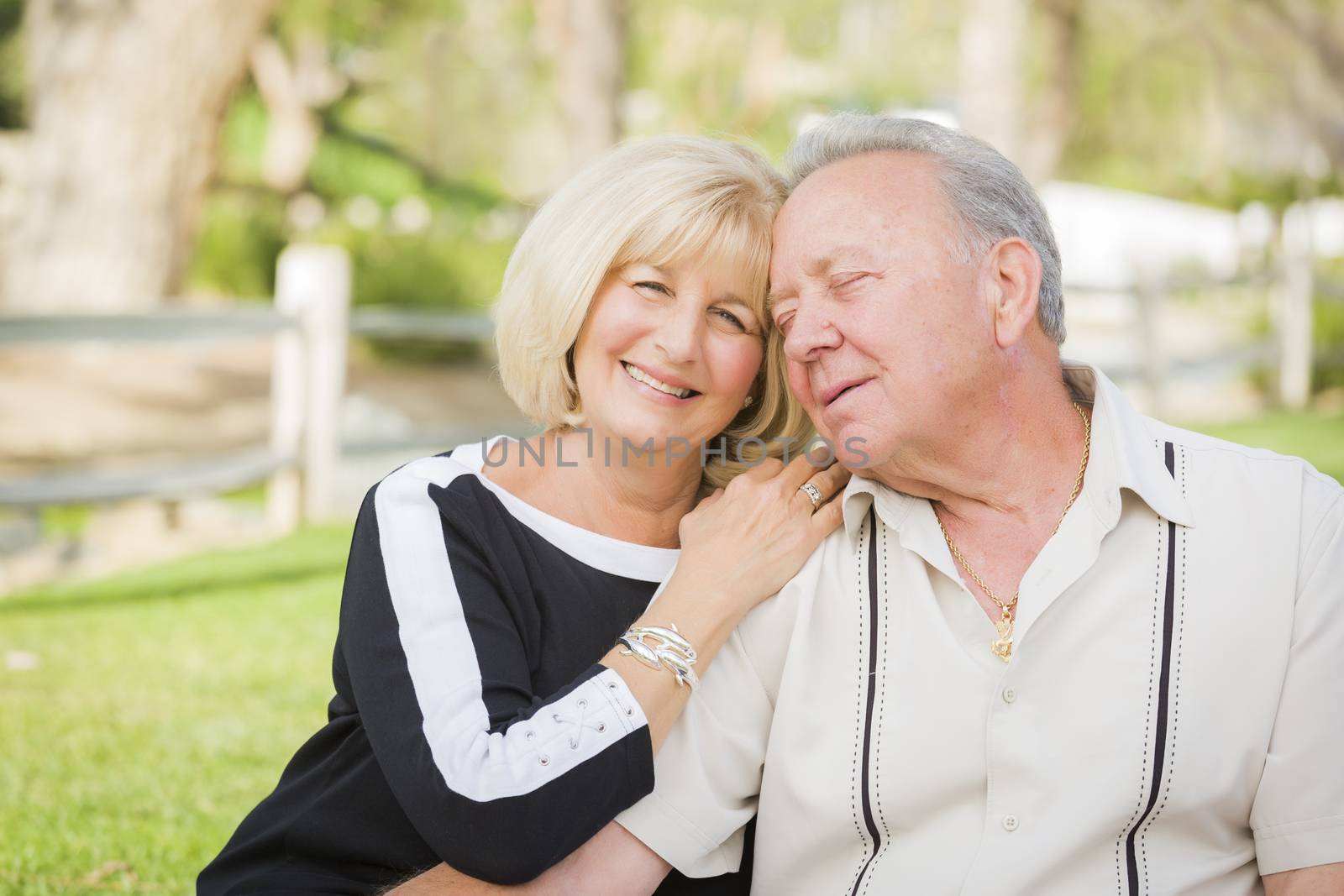 Affectionate Senior Couple Portrait Outside At The Park.