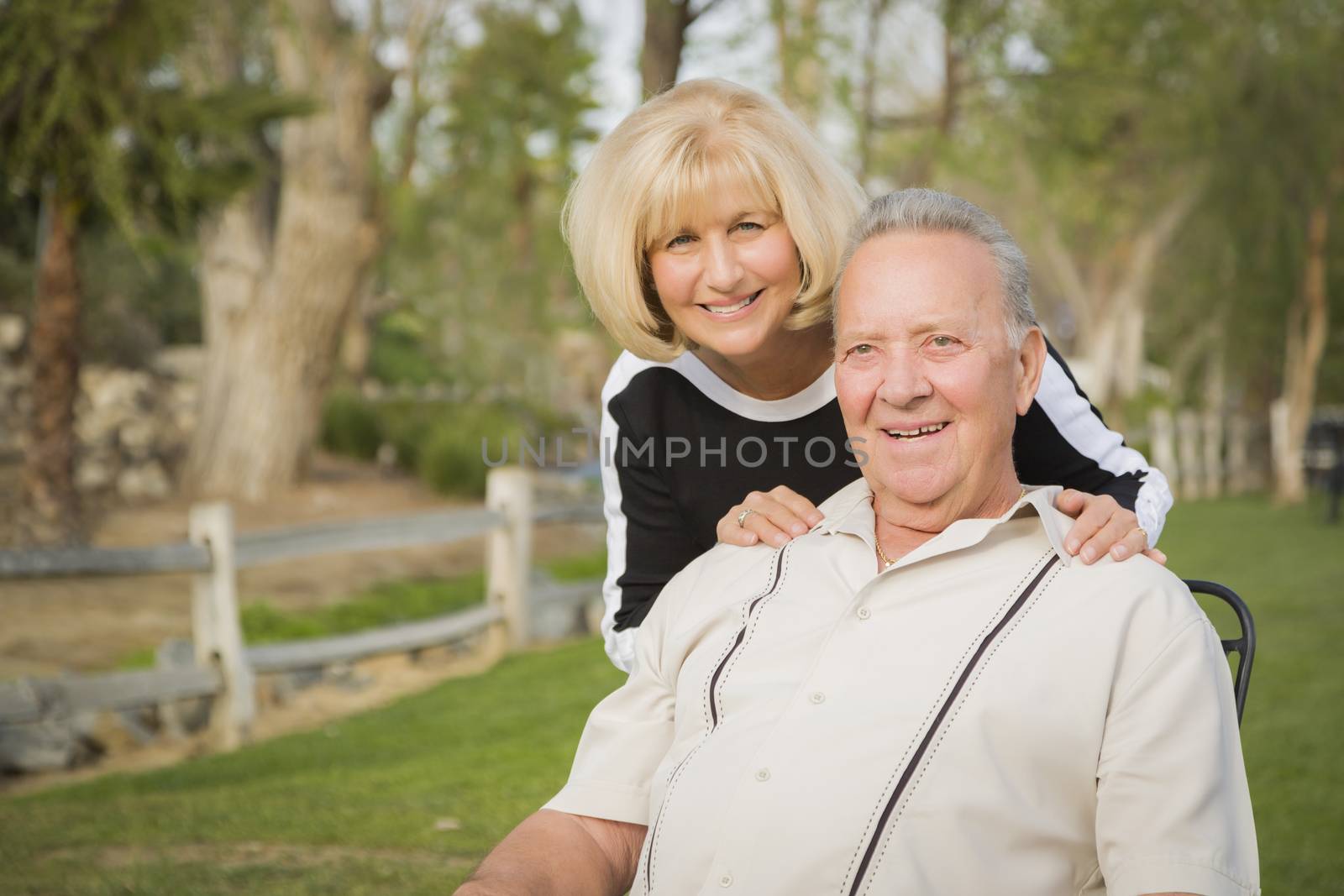 Affectionate Senior Couple Portrait Outside At The Park.