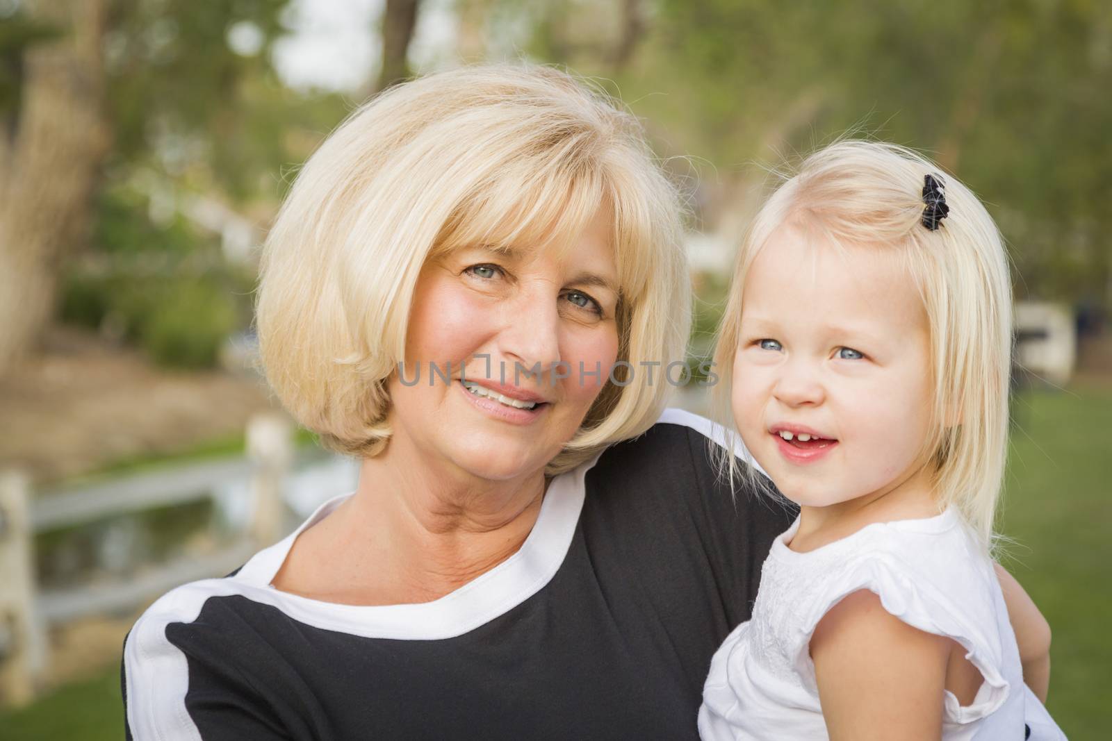 Grandmother and Granddaughter Playing At The Park by Feverpitched