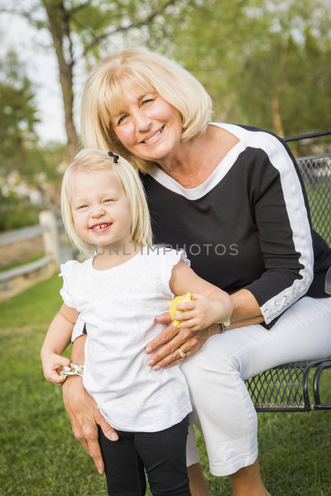 Grandmother and Granddaughter Playing At The Park by Feverpitched