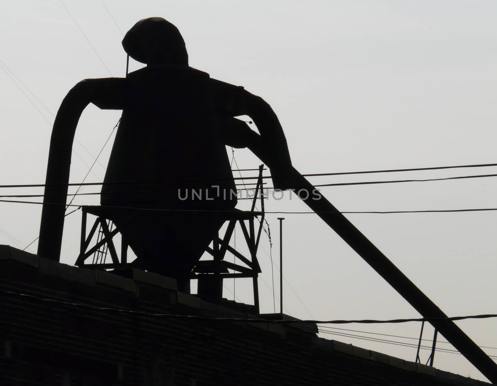 Man of iron silhouette watching Bronx from top of factory