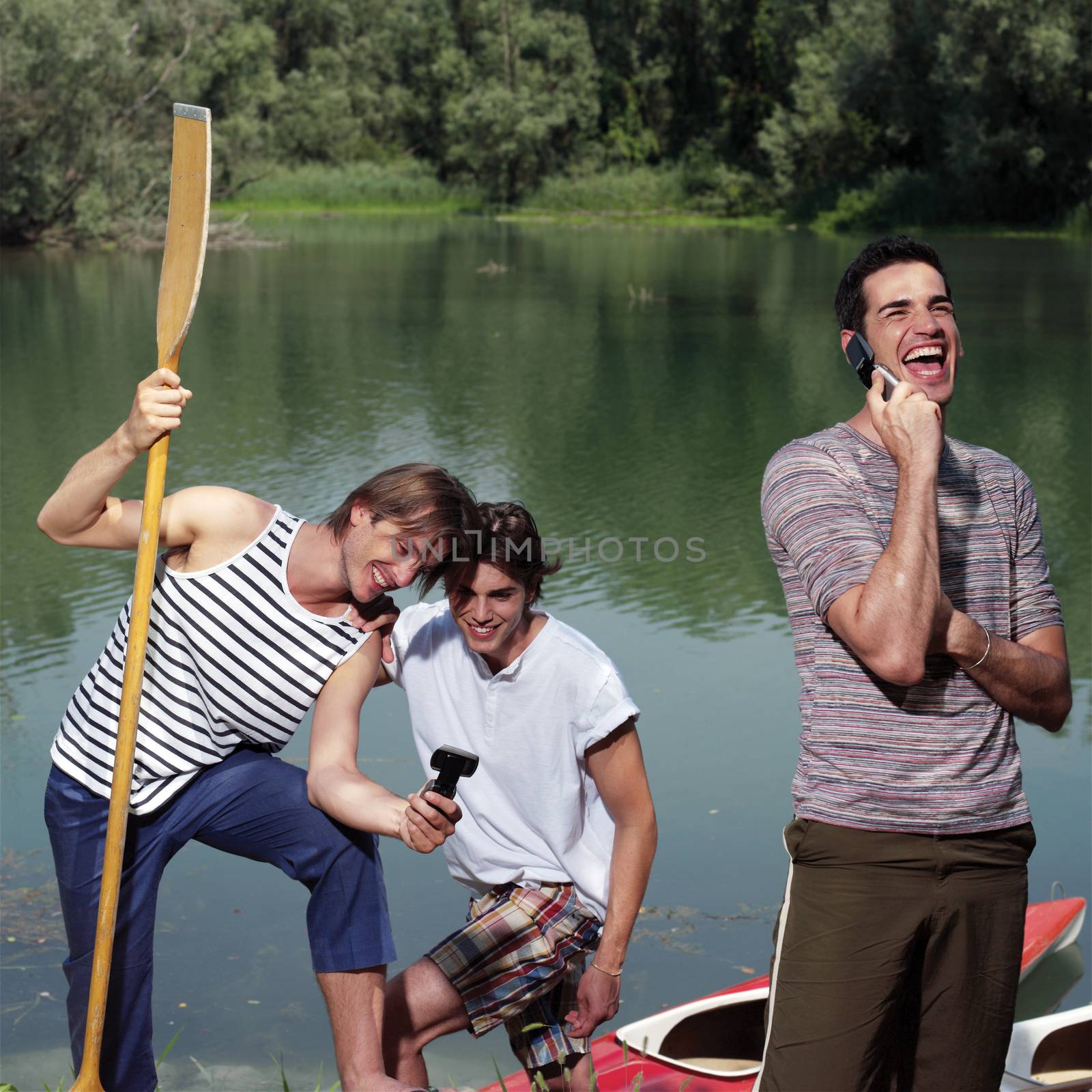 men with canoe in nature