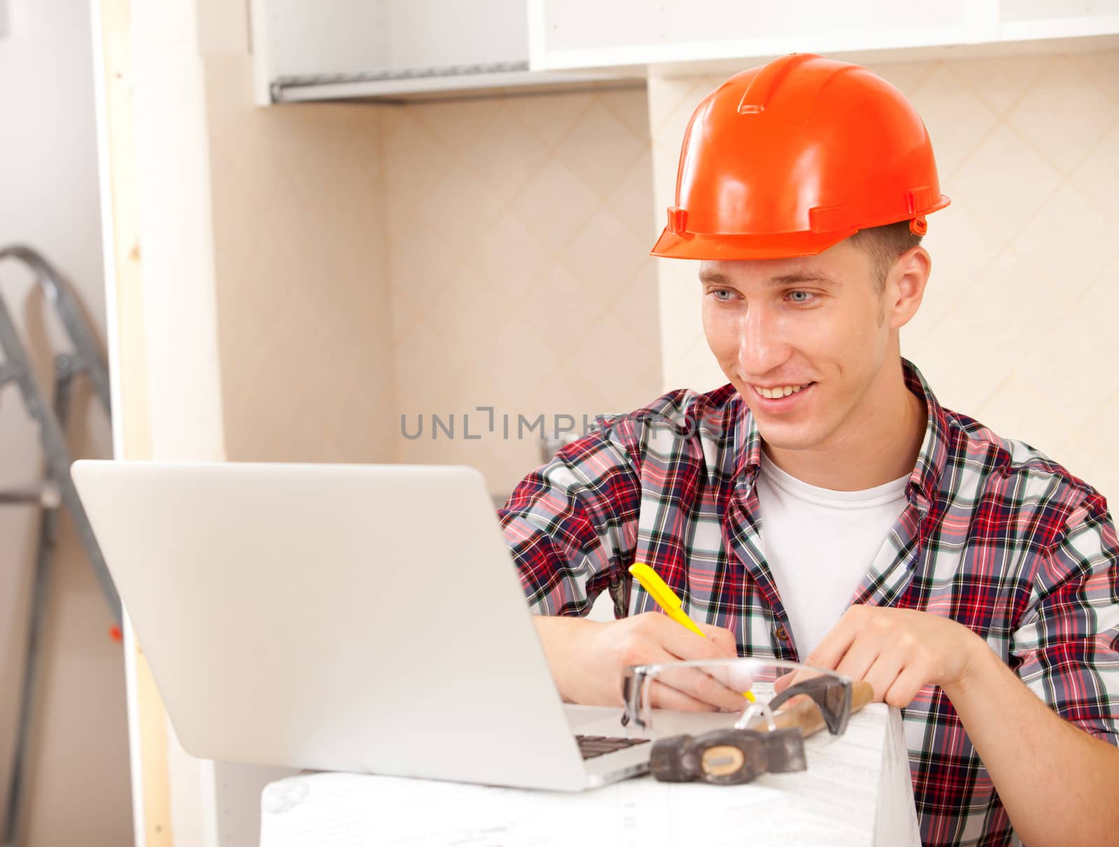 superintendent with the computer in the interior of a new apartment amends documents