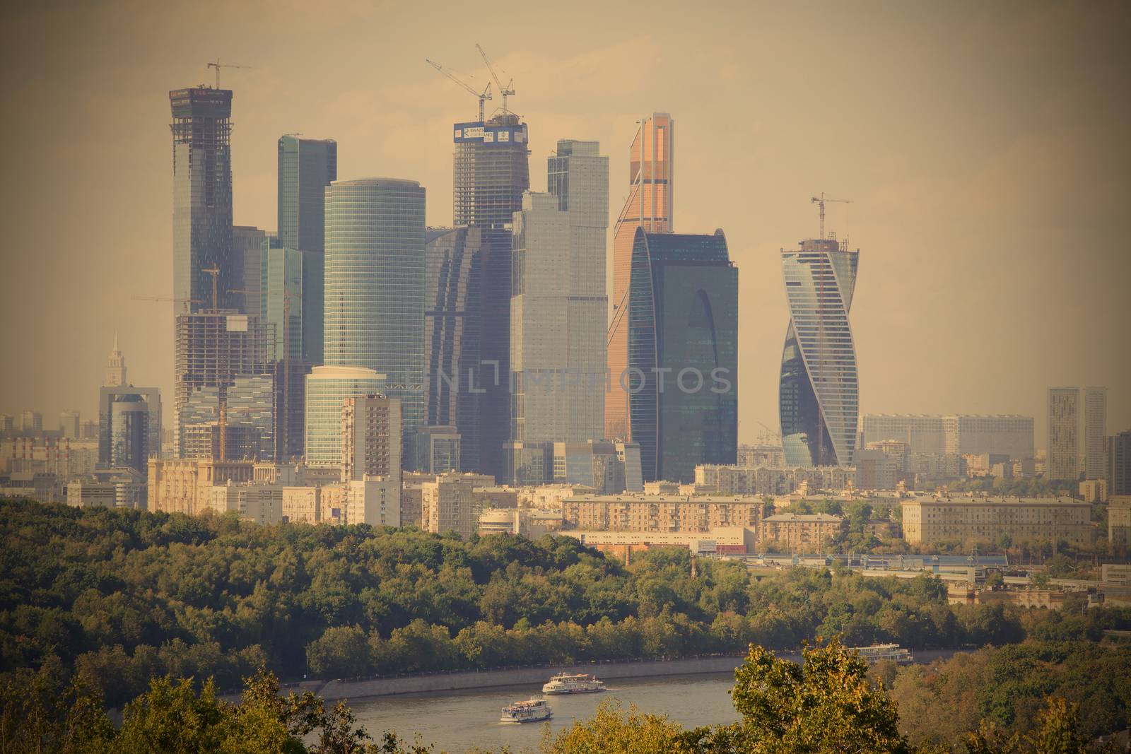 russia, moscow 21.08.2014. city panorama wit river and ships. smog over the city, instagram image style, editorial use only