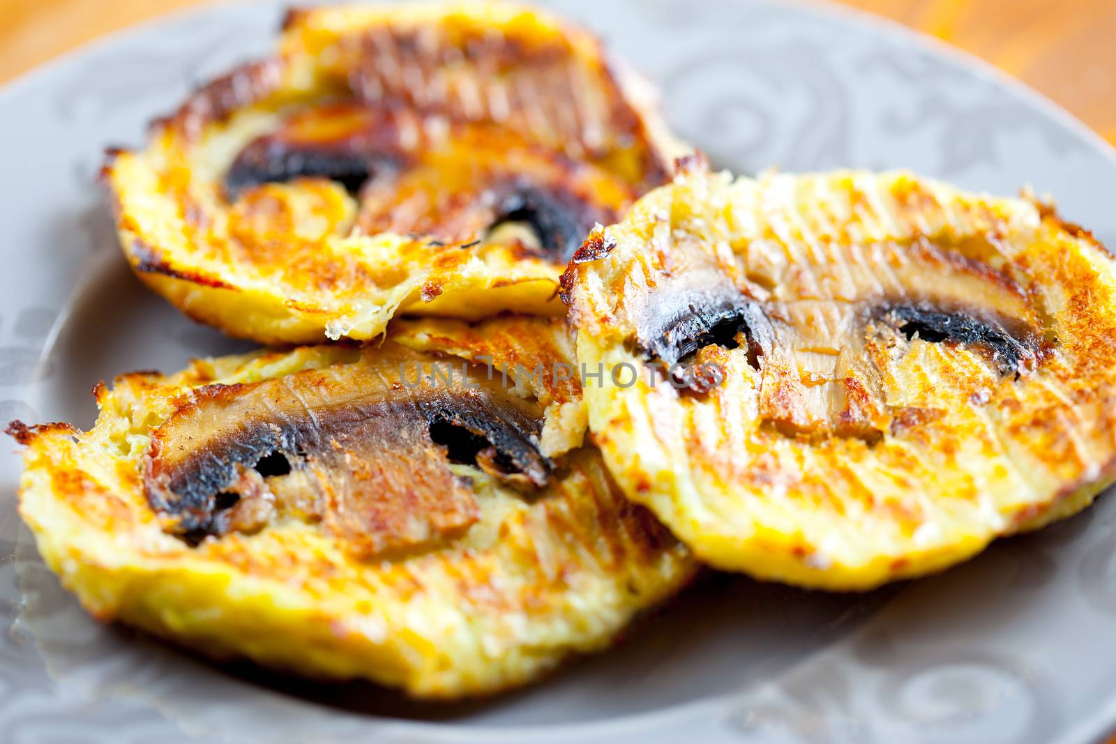 Turkey cutlets with mushrooms on a plate. Shallow depth of field