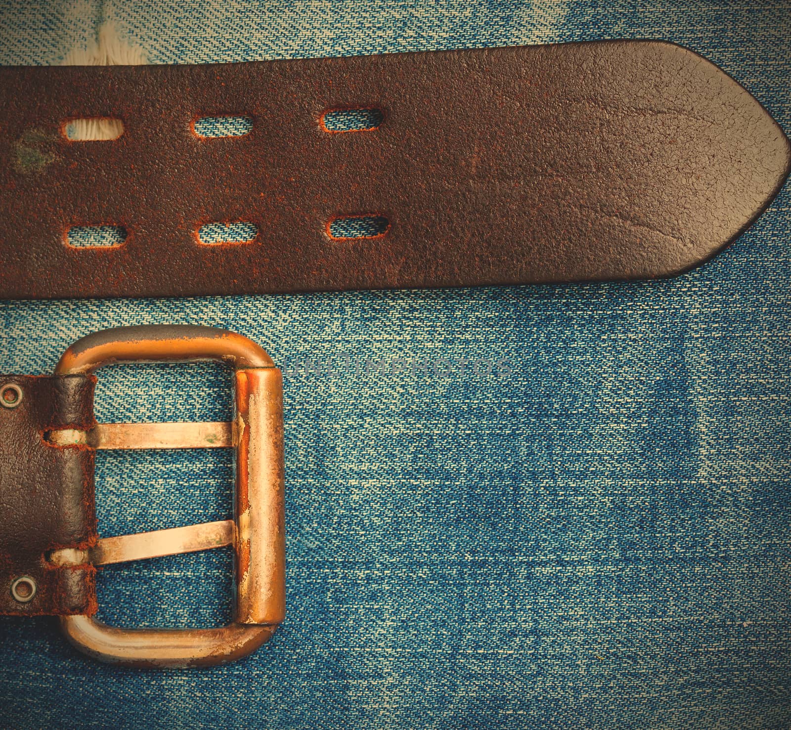 Old leather belt with a buckle by Astroid