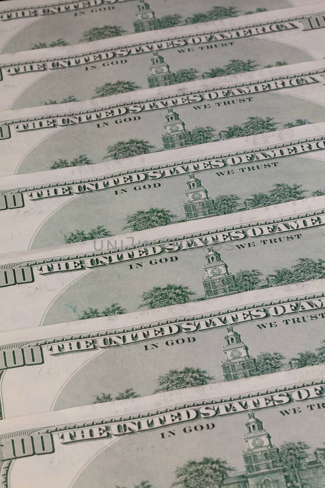 Detail of the same pattern of dollar bills on the table