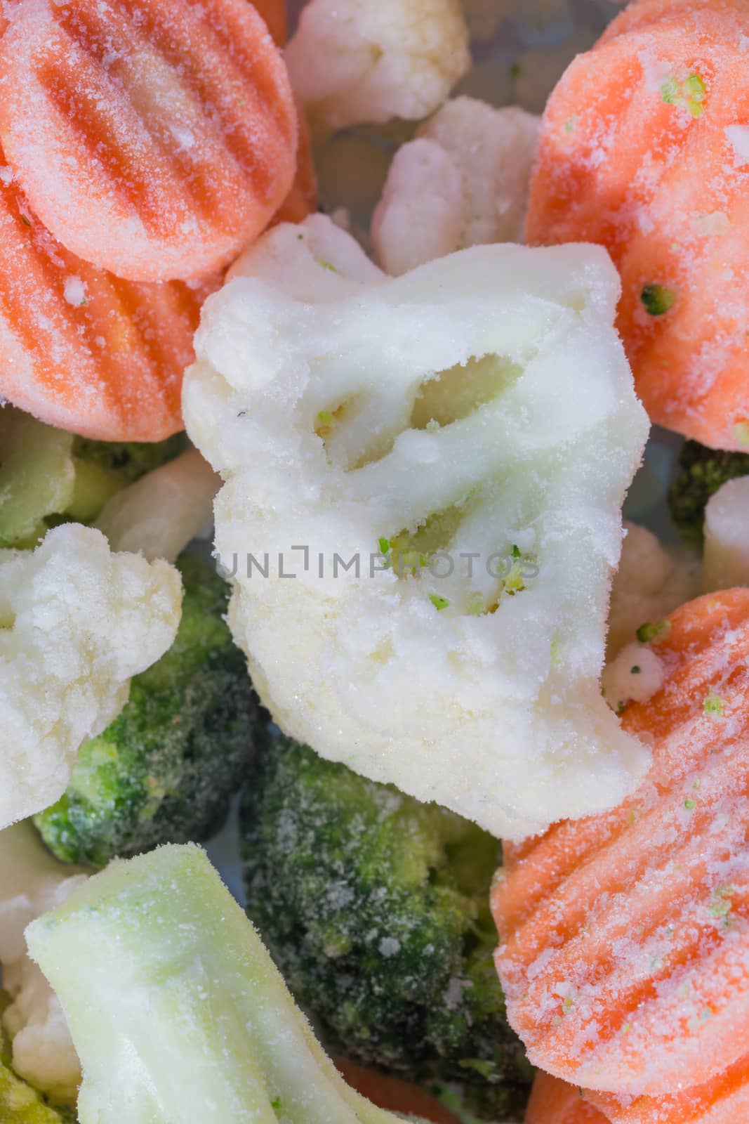 Picture of a bunch of frozen vegetables with focus at at cauliflower