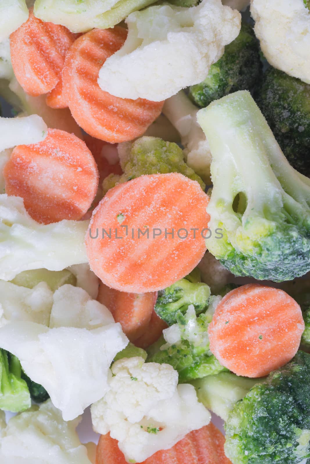 Picture of a bunch of frozen vegetables with most of the picture carrots