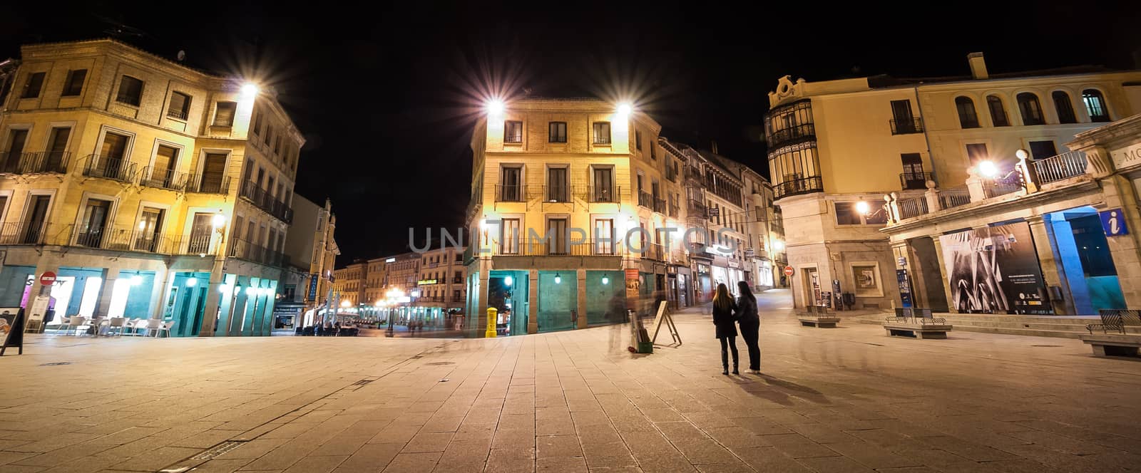 A night time view of the town square in Segovia Spain.