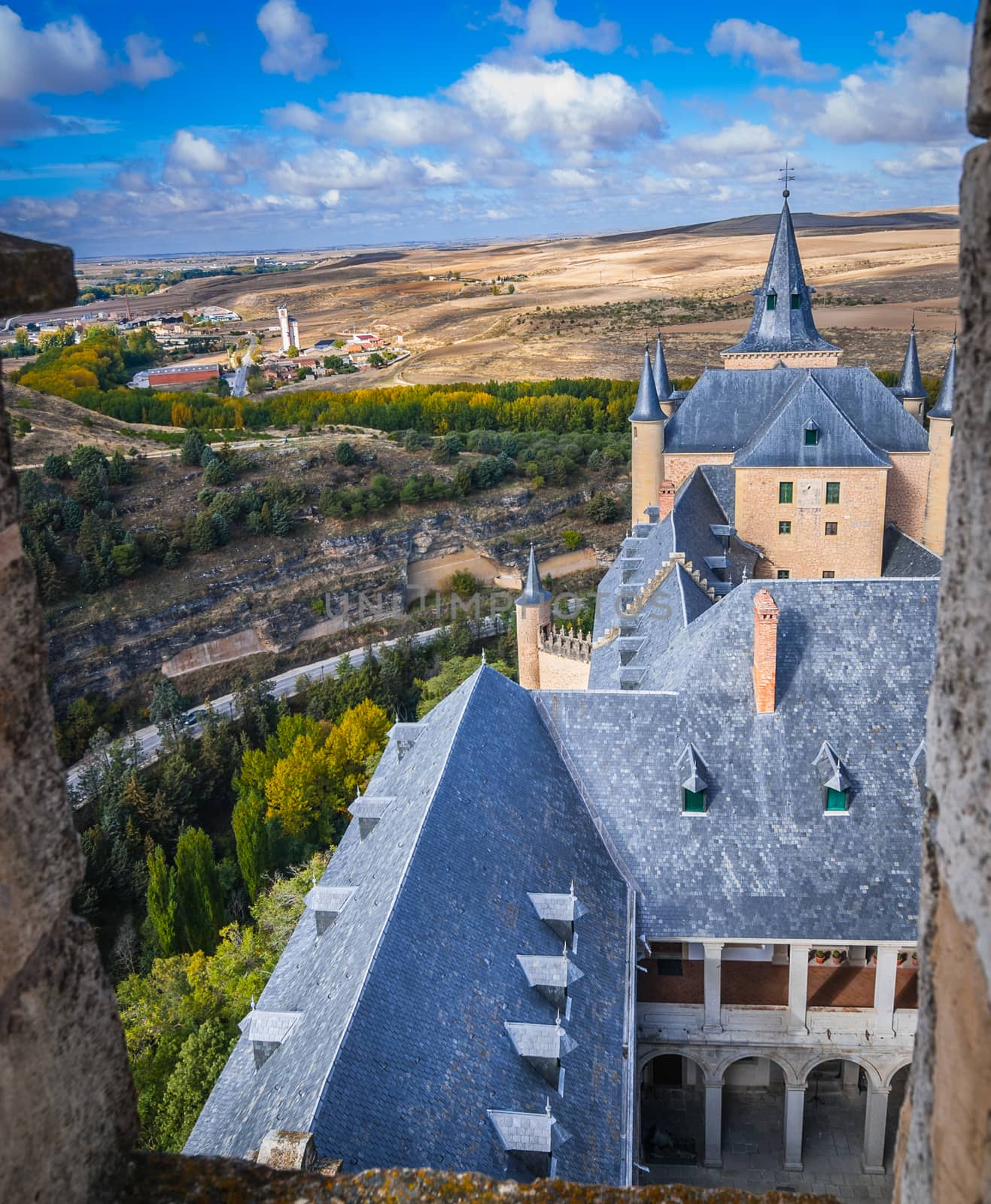 A high up view of the Spanish rural countryside and the castle, from the castle Alcazar.