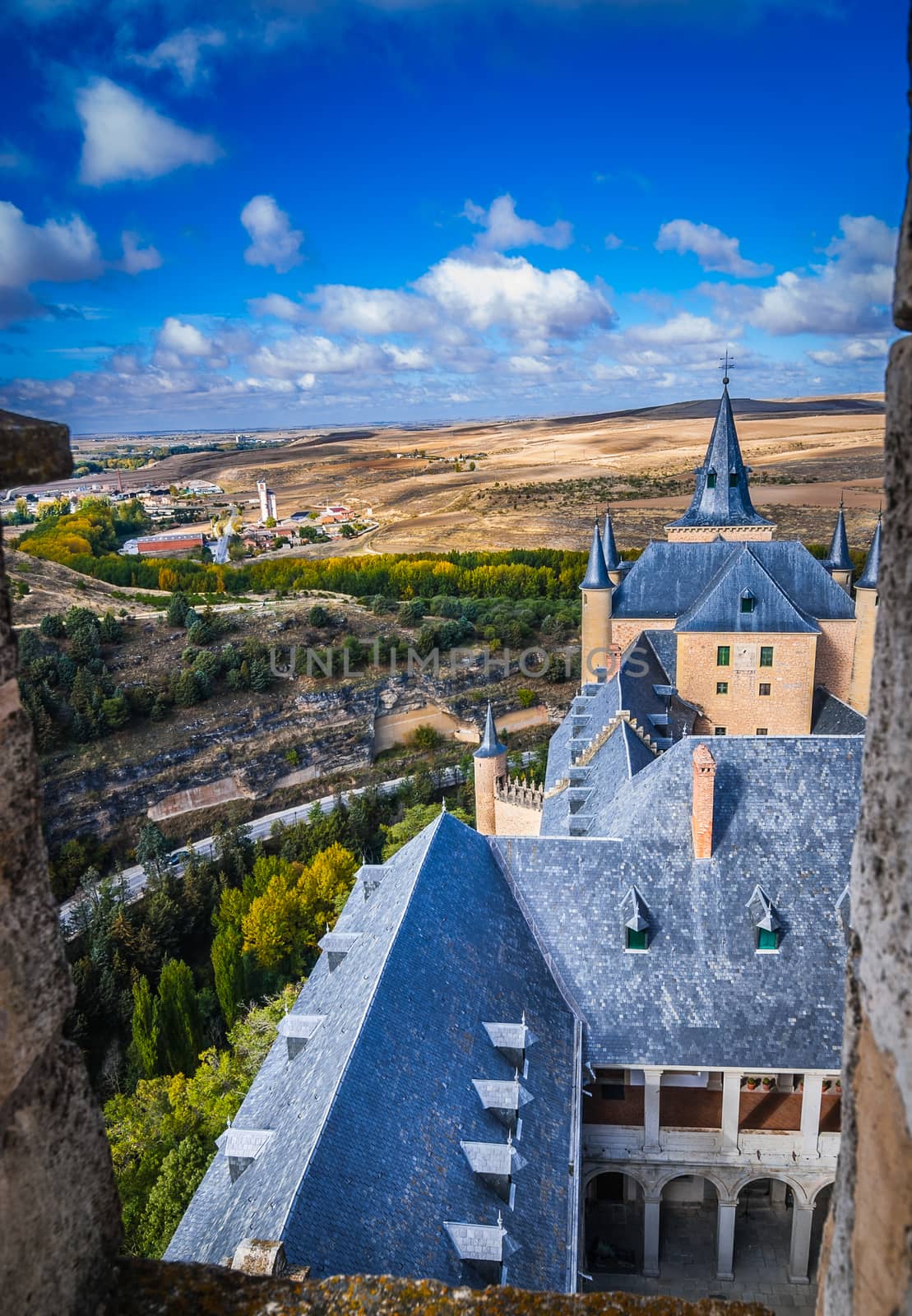 A high up view of the Spanish rural countryside and the castle, from the castle Alcazar.