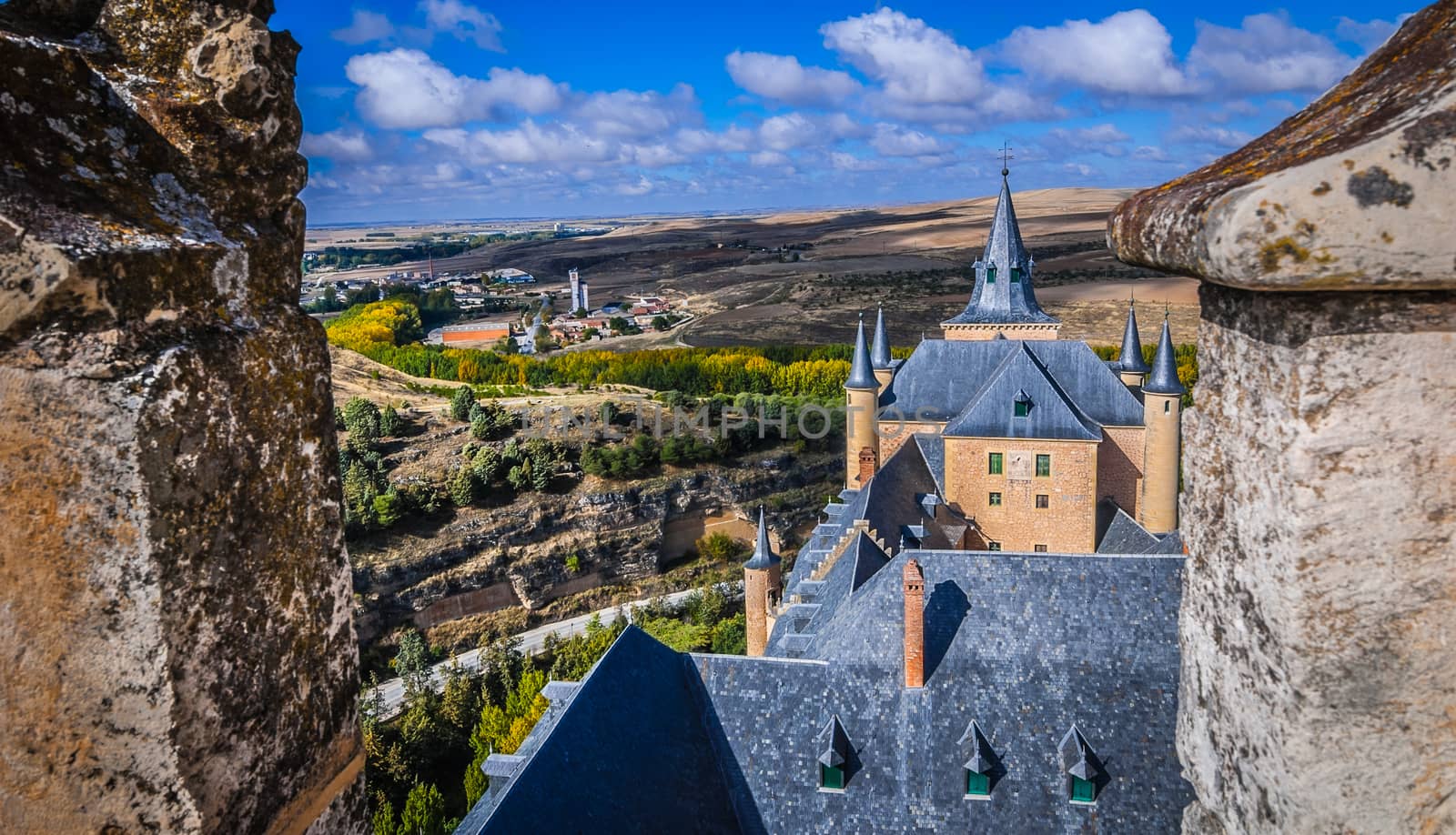 A high up view of the Spanish rural countryside and the castle, from the castle Alcazar.
