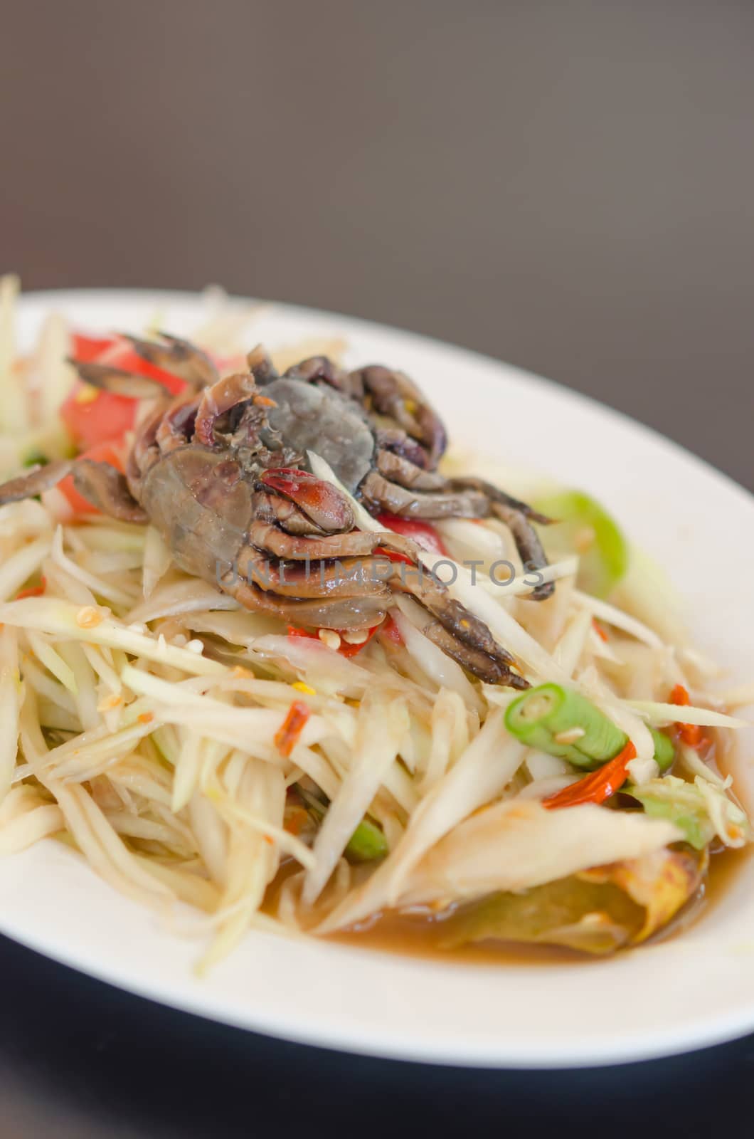 spicy papaya salad with crab on dish , asian spicy food