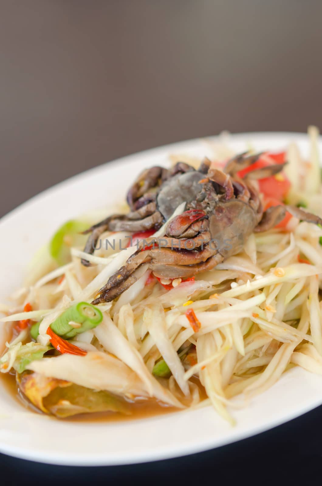 spicy papaya salad with crab on dish , asian spicy food