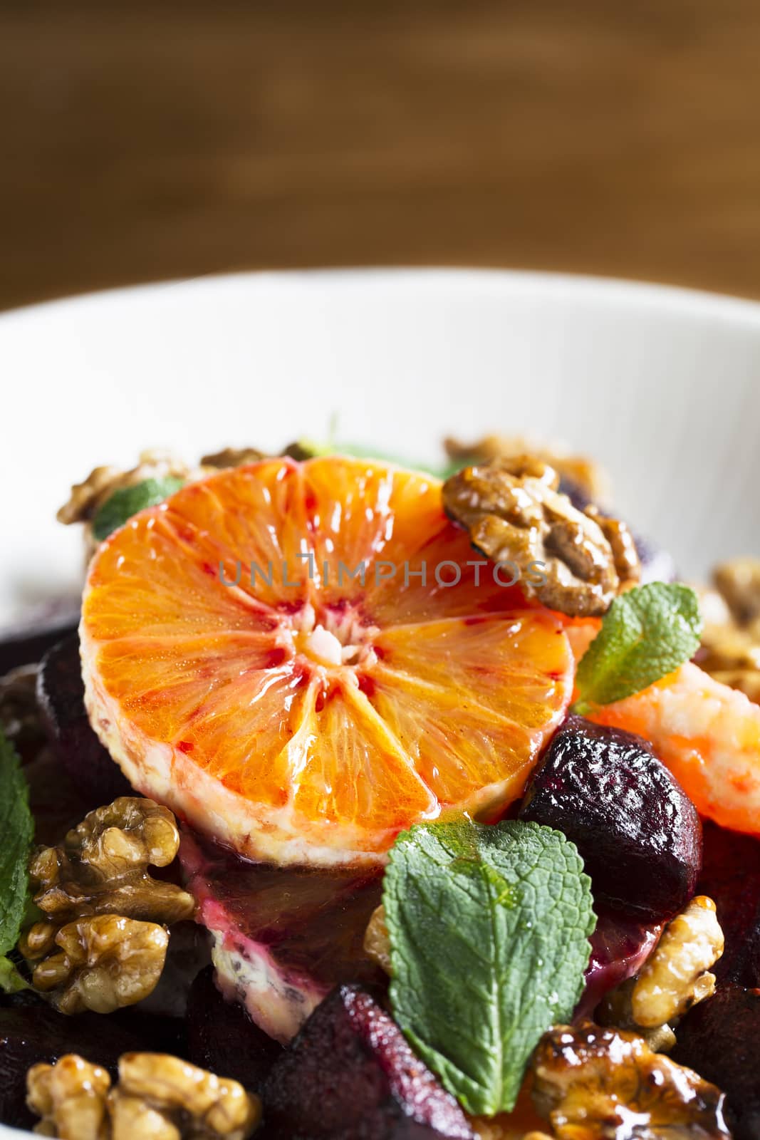 Beetroot and Orange salad with walnuts and mint leaves.