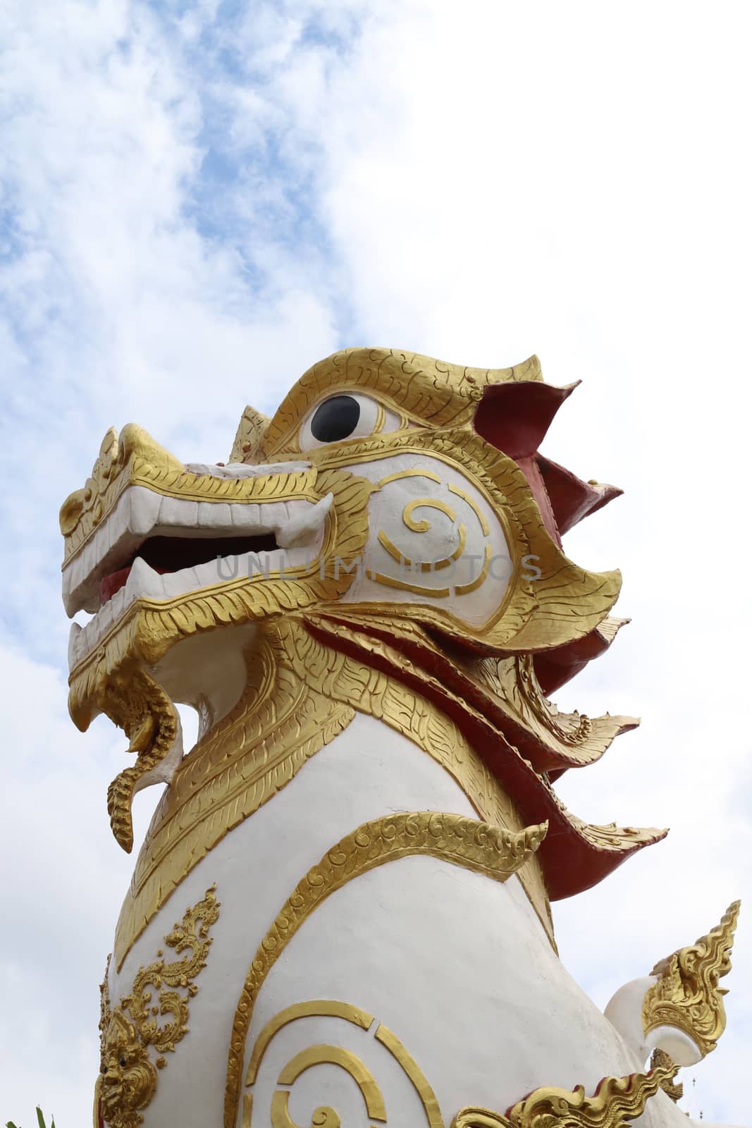 Lion in Buddhist religion.The large sculpture in front of the entrance of every  temple.