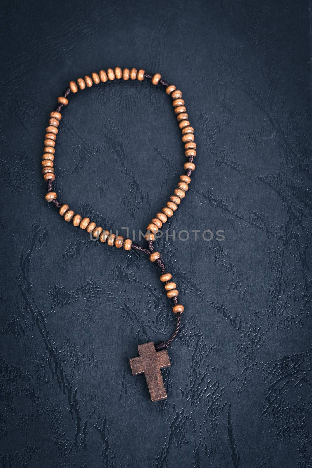 Christian cross necklace on Holy Bible book, Jesus religion concept as good friday or easter festival