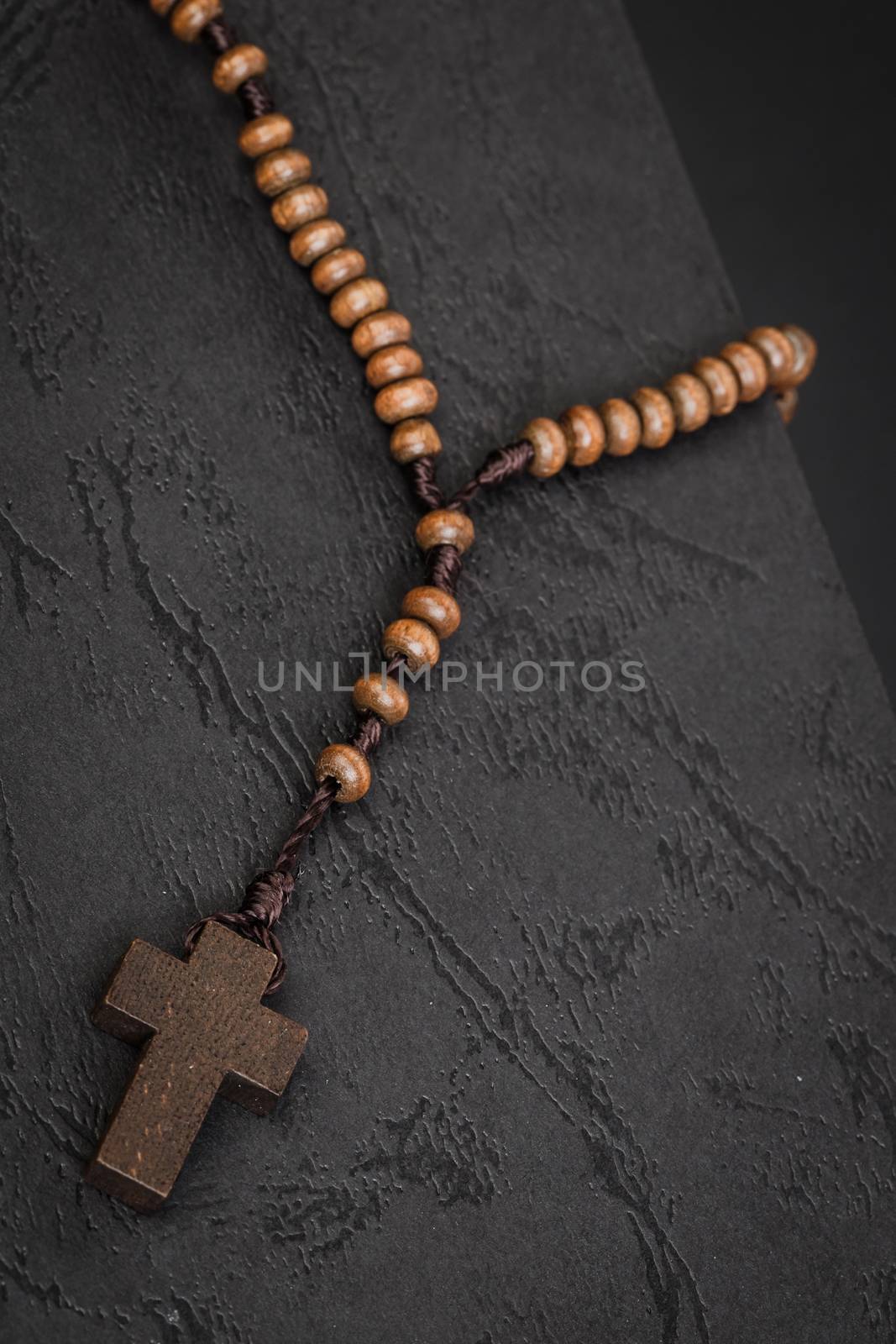 Christian cross necklace on Holy Bible book, Jesus religion concept as good friday or easter festival