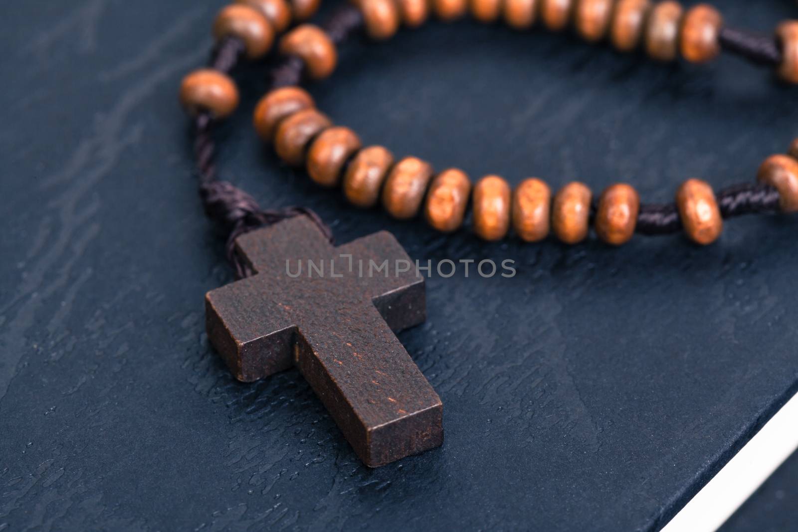 Christian cross necklace on Holy Bible book, Jesus religion concept as good friday or easter festival