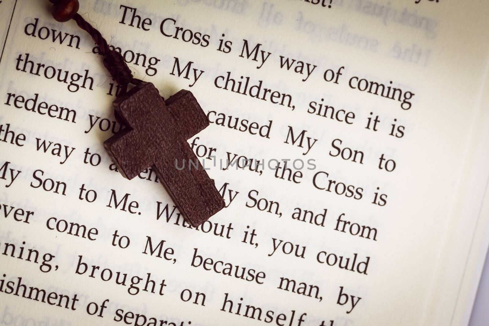 Christian cross necklace on Holy Bible book, Jesus religion conc by FrameAngel