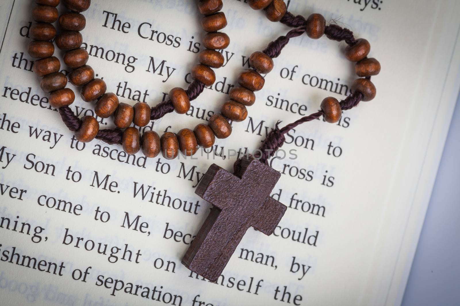 Christian cross necklace on Holy Bible book, Jesus religion concept as good friday or easter festival