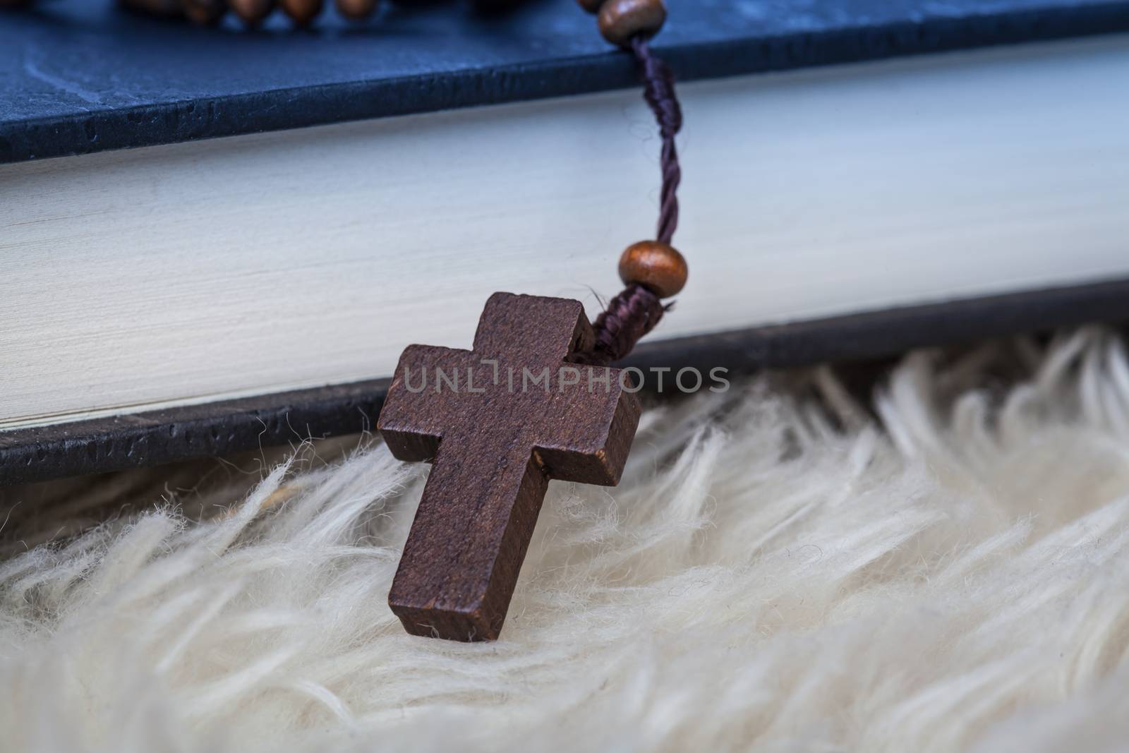 Christian cross necklace on Holy Bible book, Jesus religion concept as good friday or easter festival