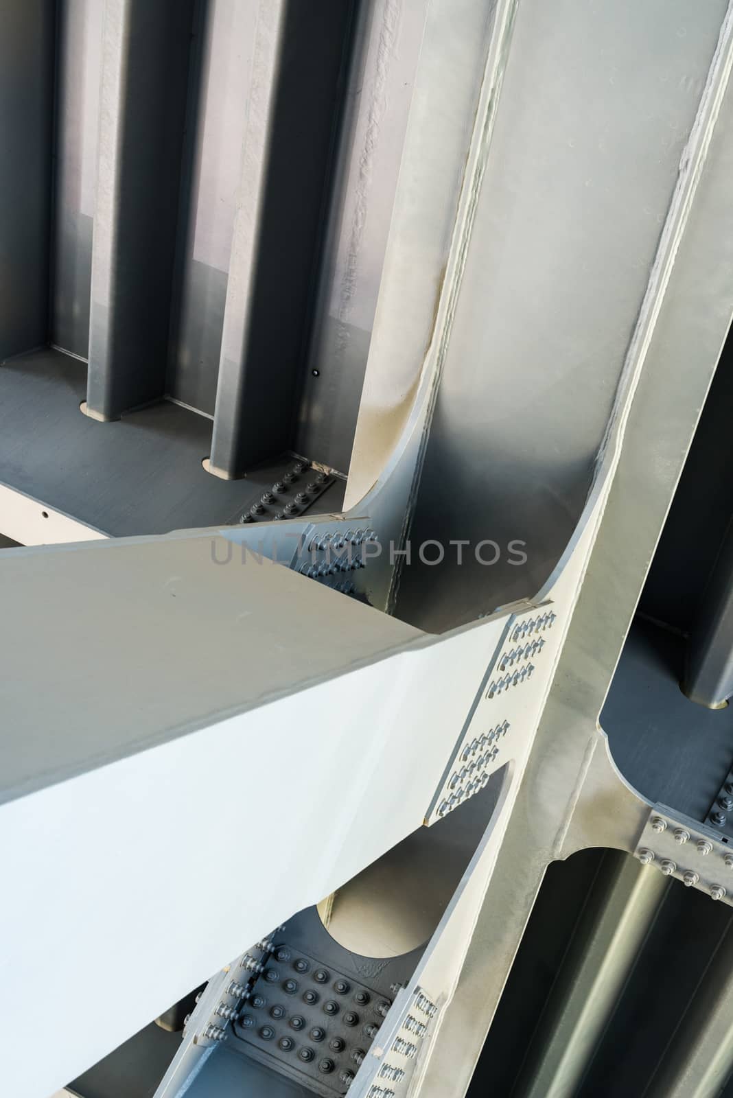 Gray metal framework of the bridge. Industrial surface. Close up.