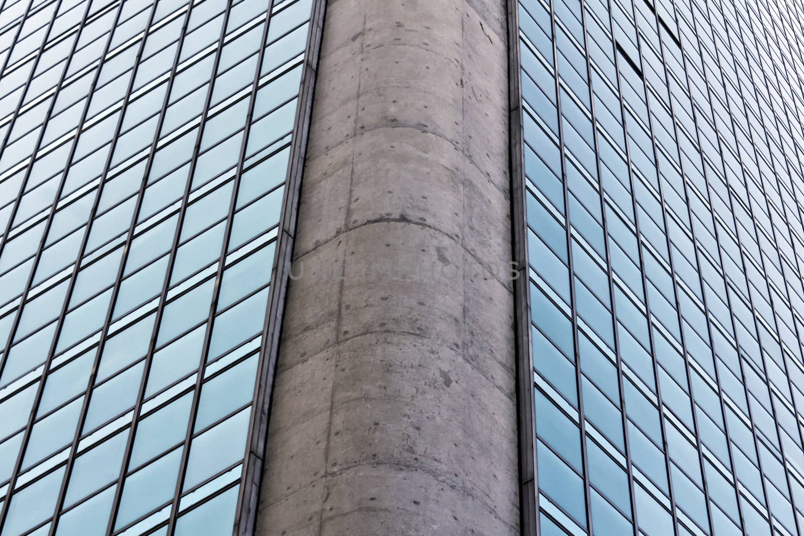 Modern building with glass facade in blue