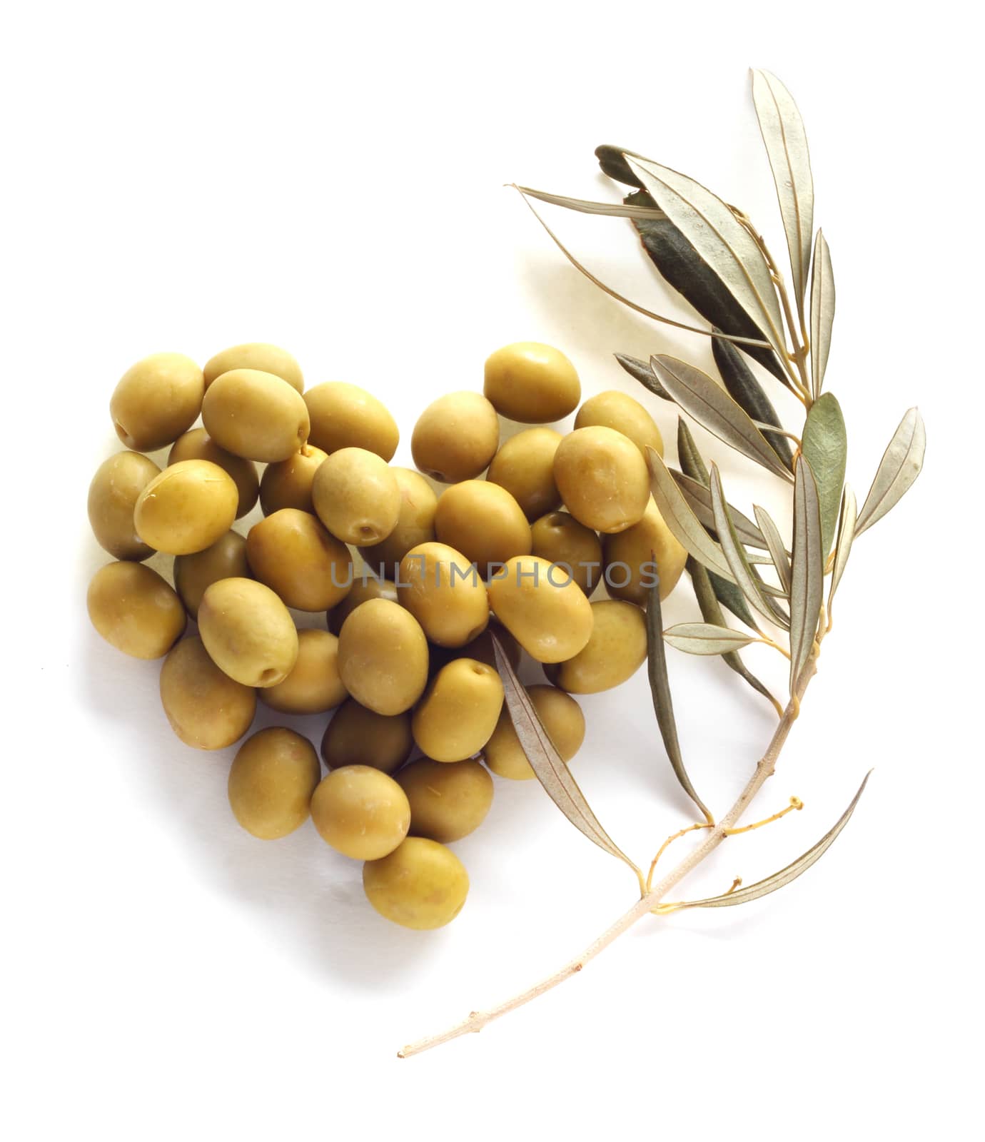Olives in heart shape isolated on white background