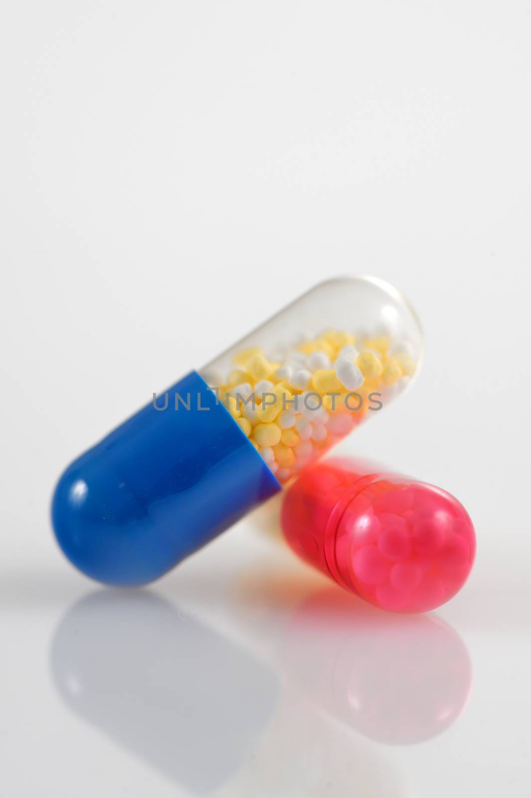 Medicine pills over white background