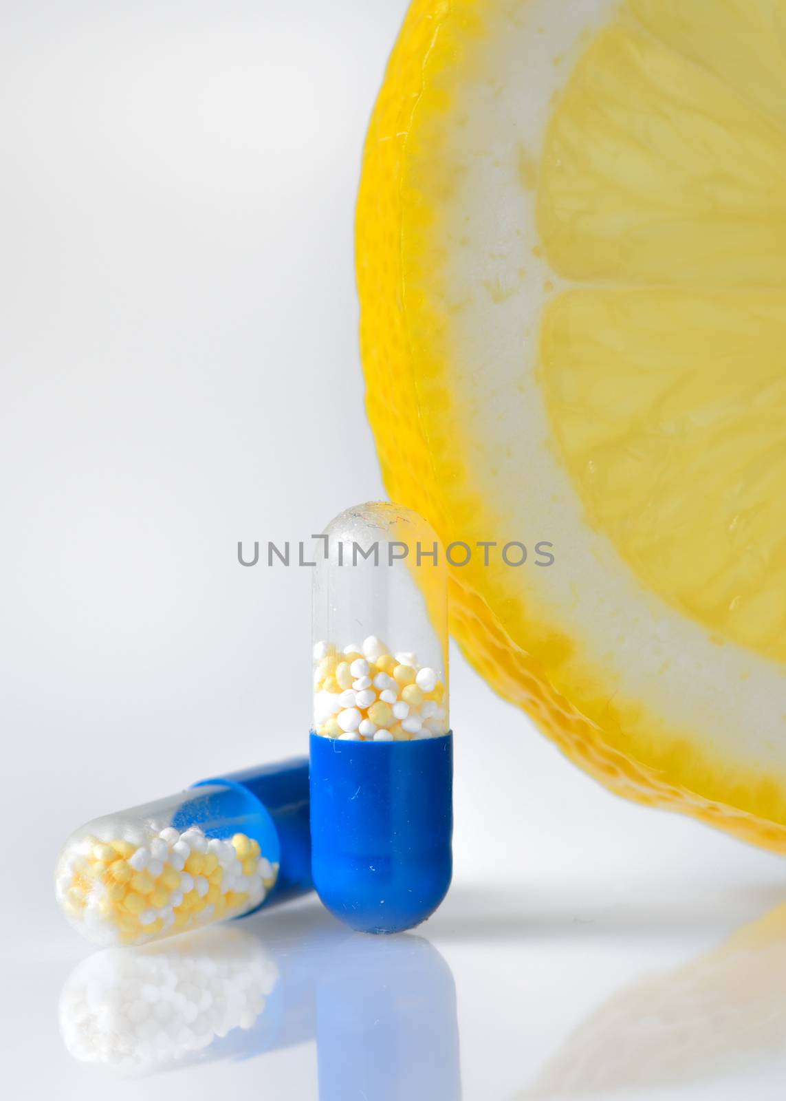 vitamin c pills and lemon slice