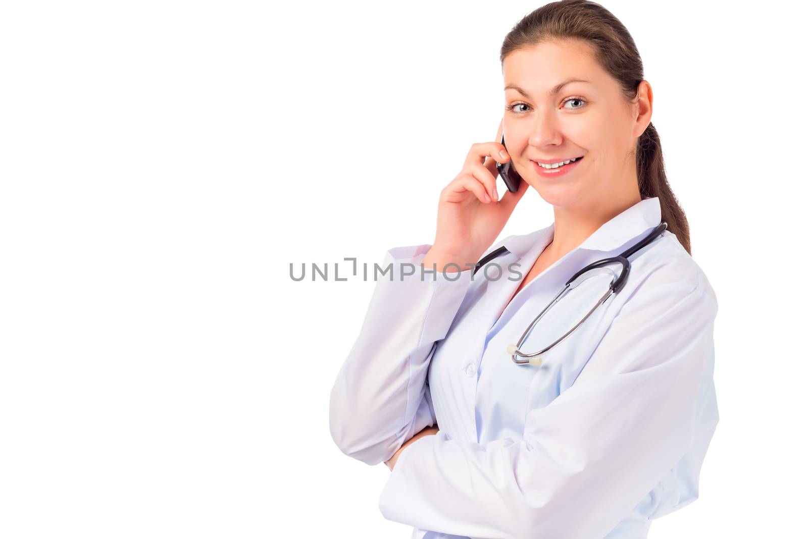 Smiling doctor talking on the phone on a white background by kosmsos111
