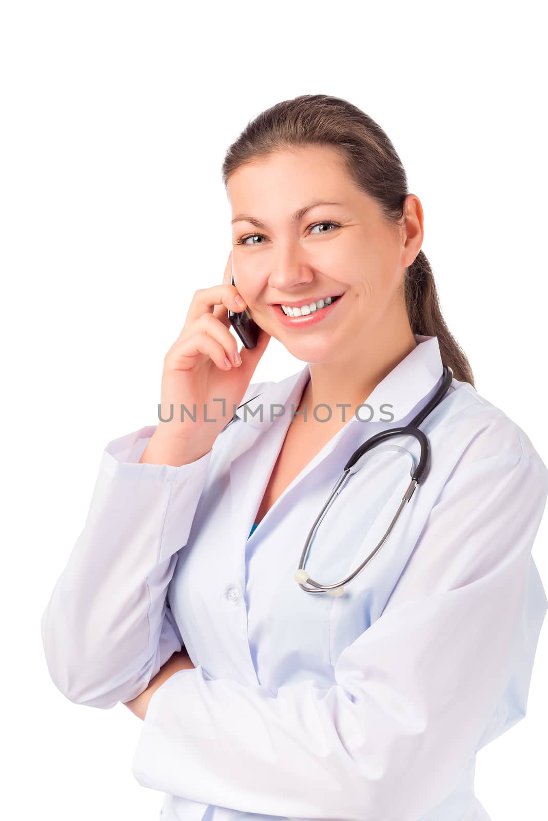 beautiful brunette Doctor with a phone on a white background
