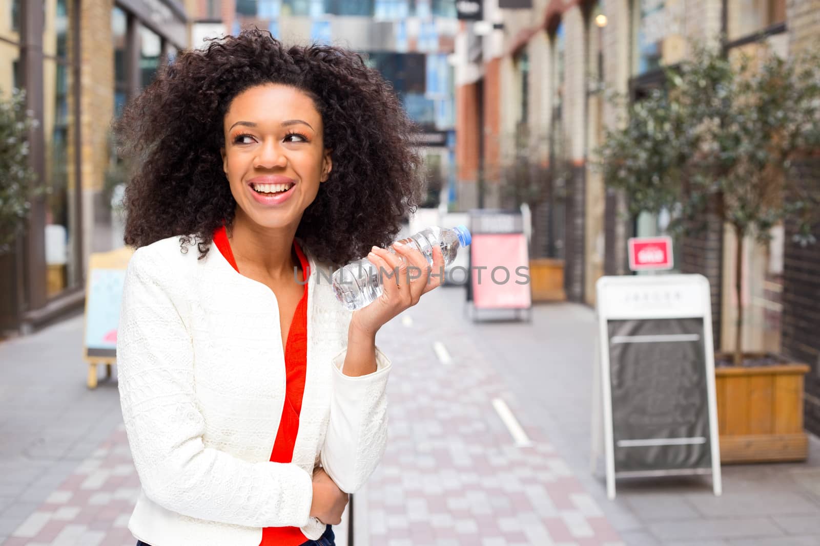 young woman holding a water bottle.