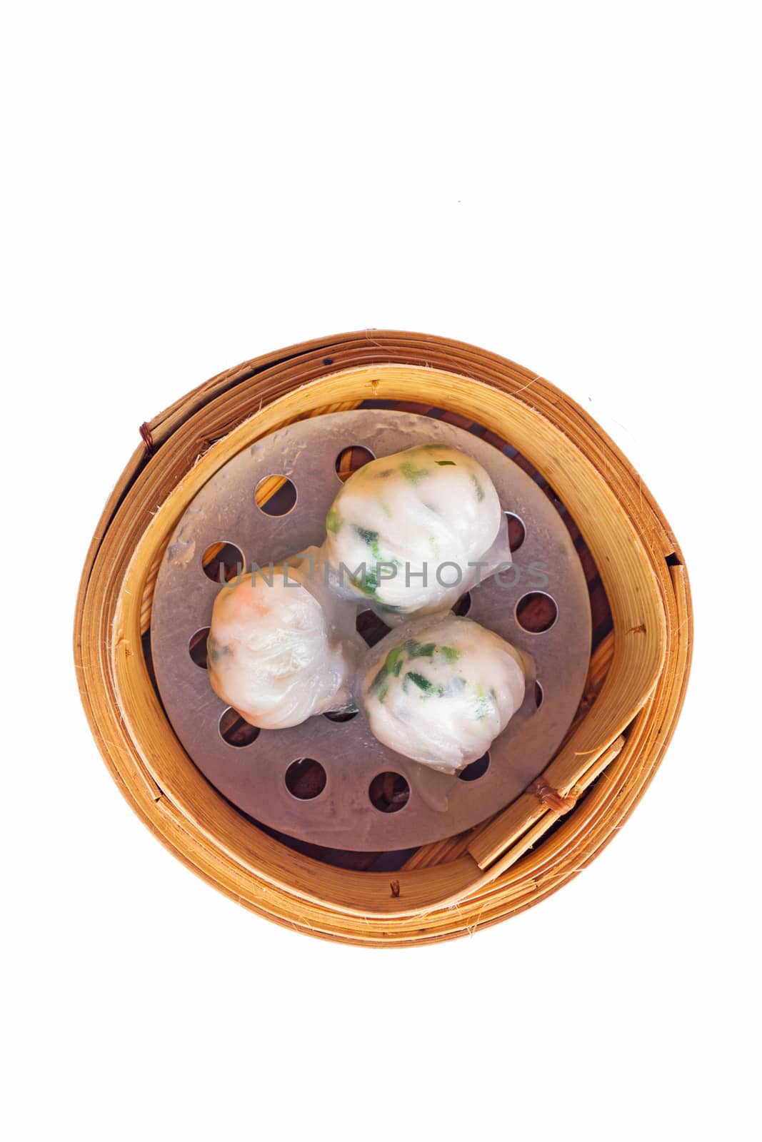 Dimsum in the steam basket . Chinese dimsum steamer prawn isolated on white background.