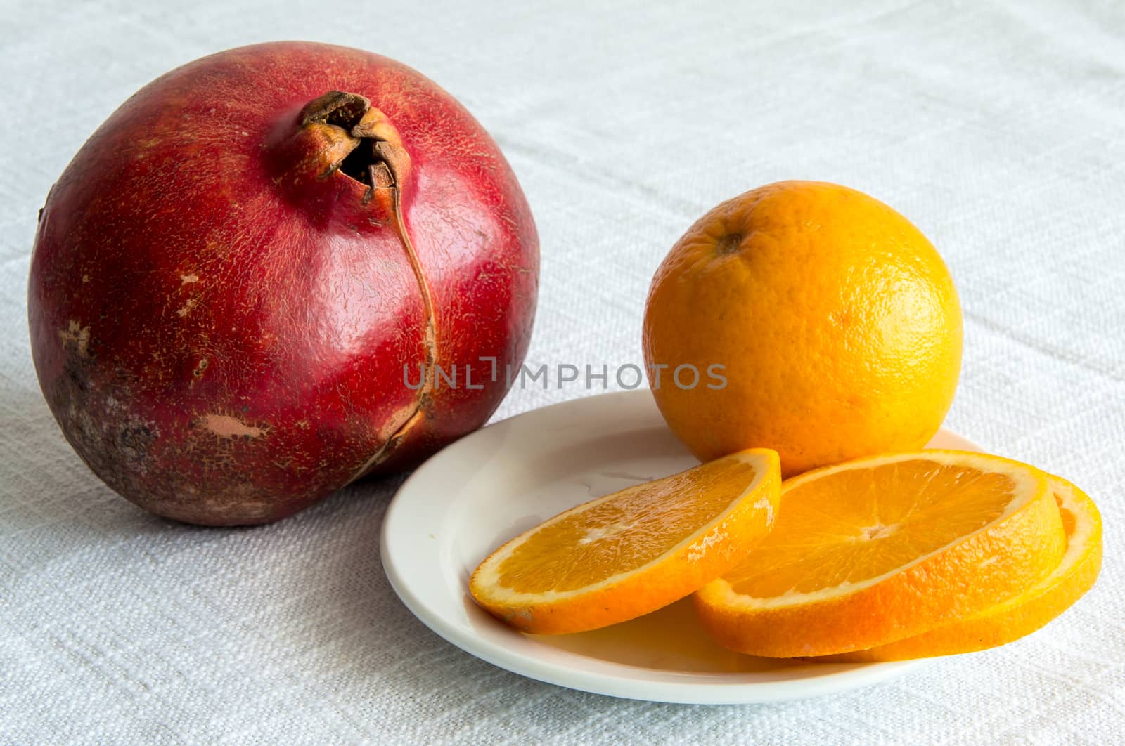 garnet and cut orange to rest upon tablecloths