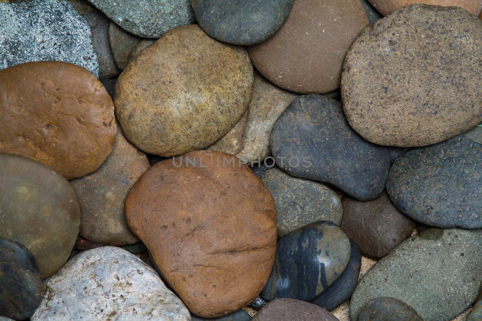 Pile of round peeble stones for background