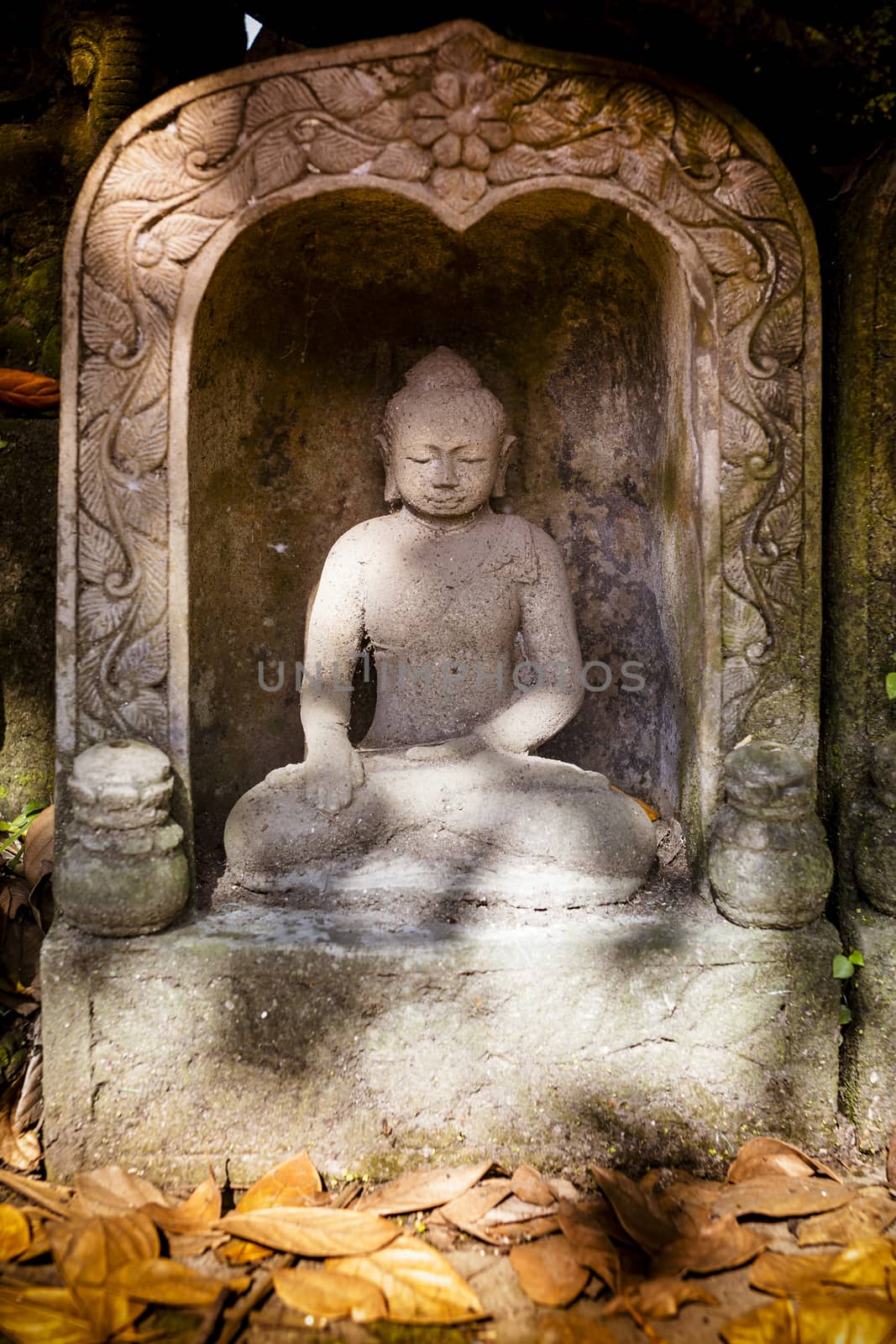 The old stone Buddha statue. Indonesia, Bali.
