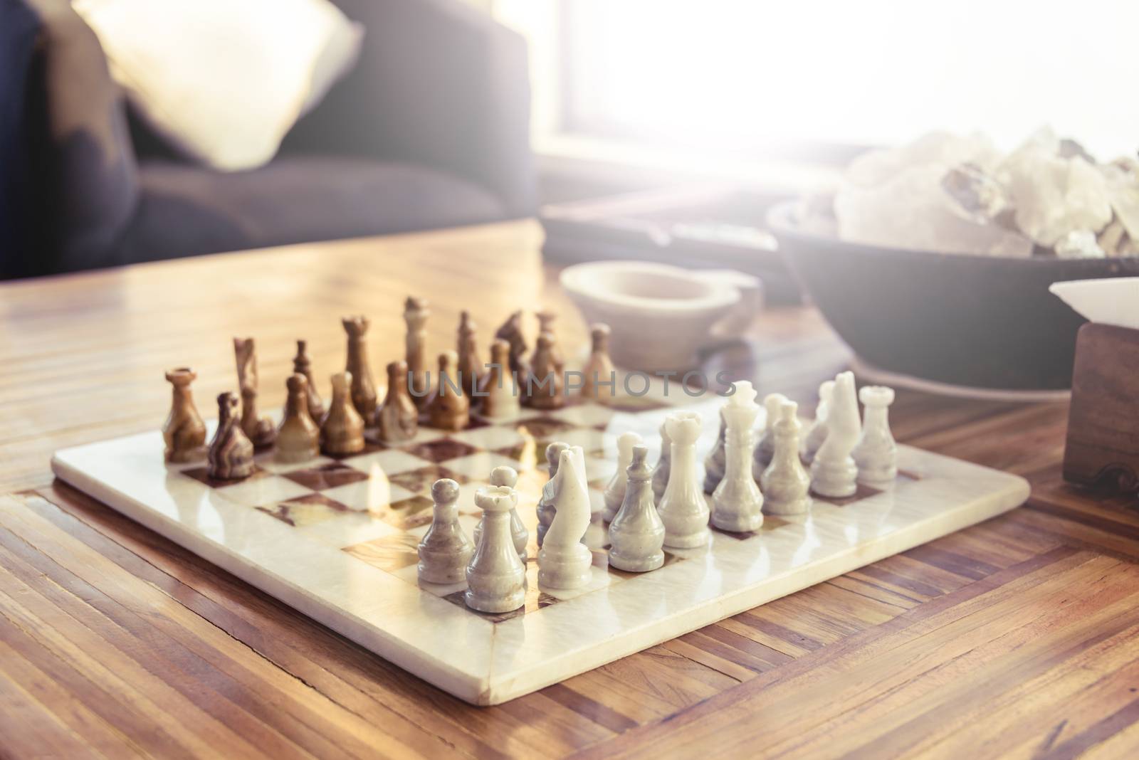 Stone chess game on a wooden table