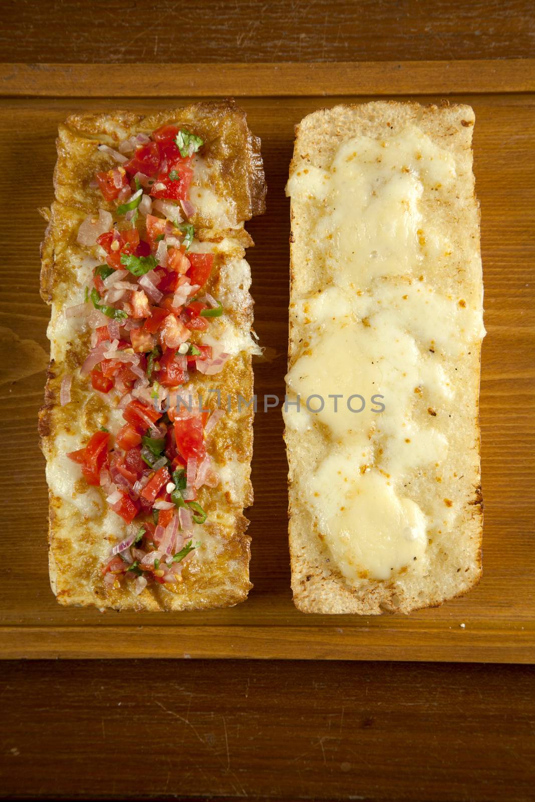 Toasted open faced salsa and egg sandwich with melted mozzarella by haiderazim