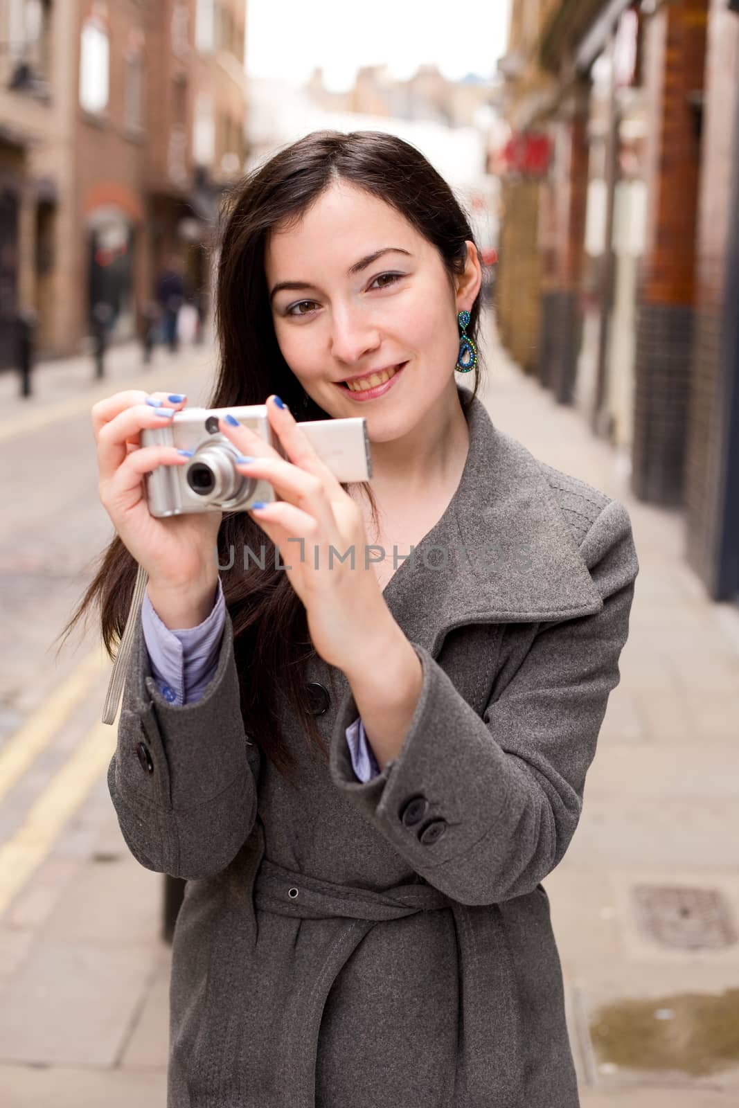 young woman holding a camera