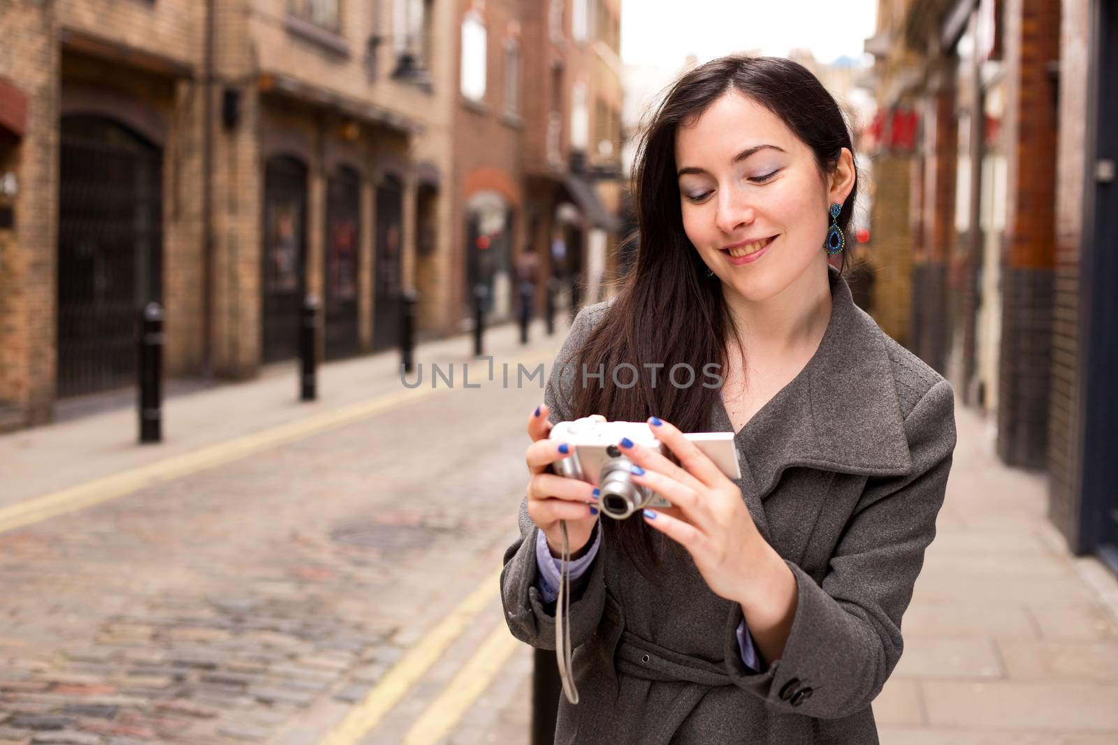 young woman looking at hers photo's