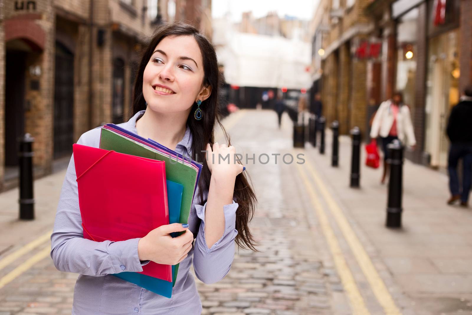 young woman holding folders