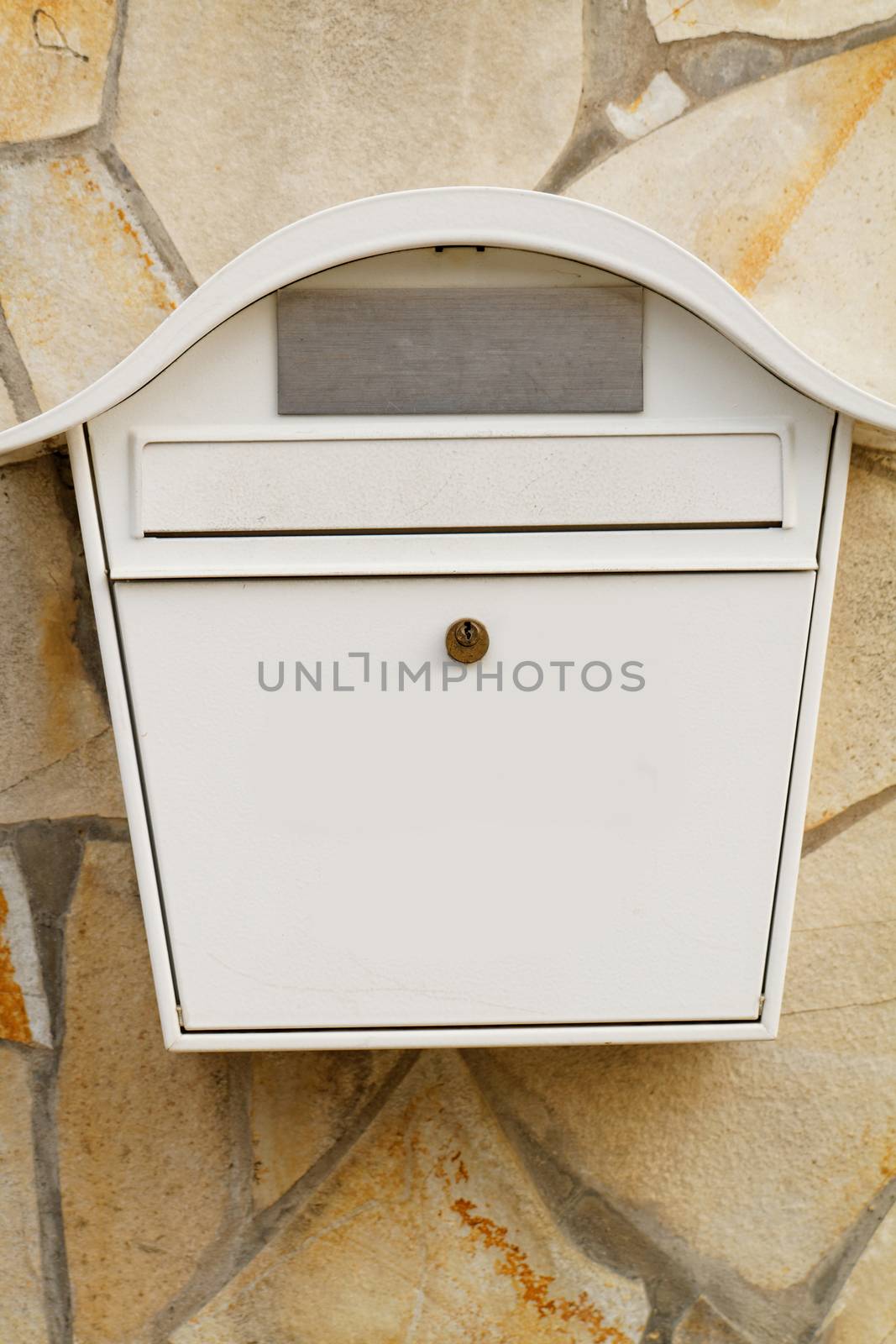 Photo of a white mailbox on the wall