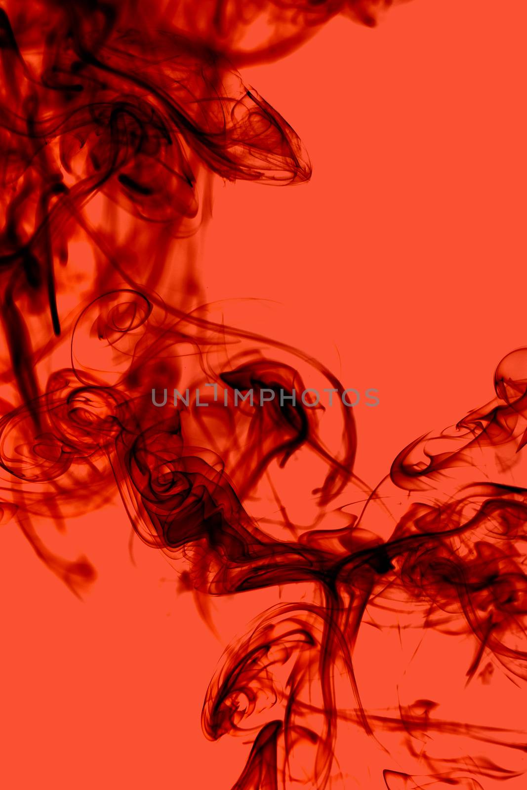 Beautiful smoke on the red background - macro photo